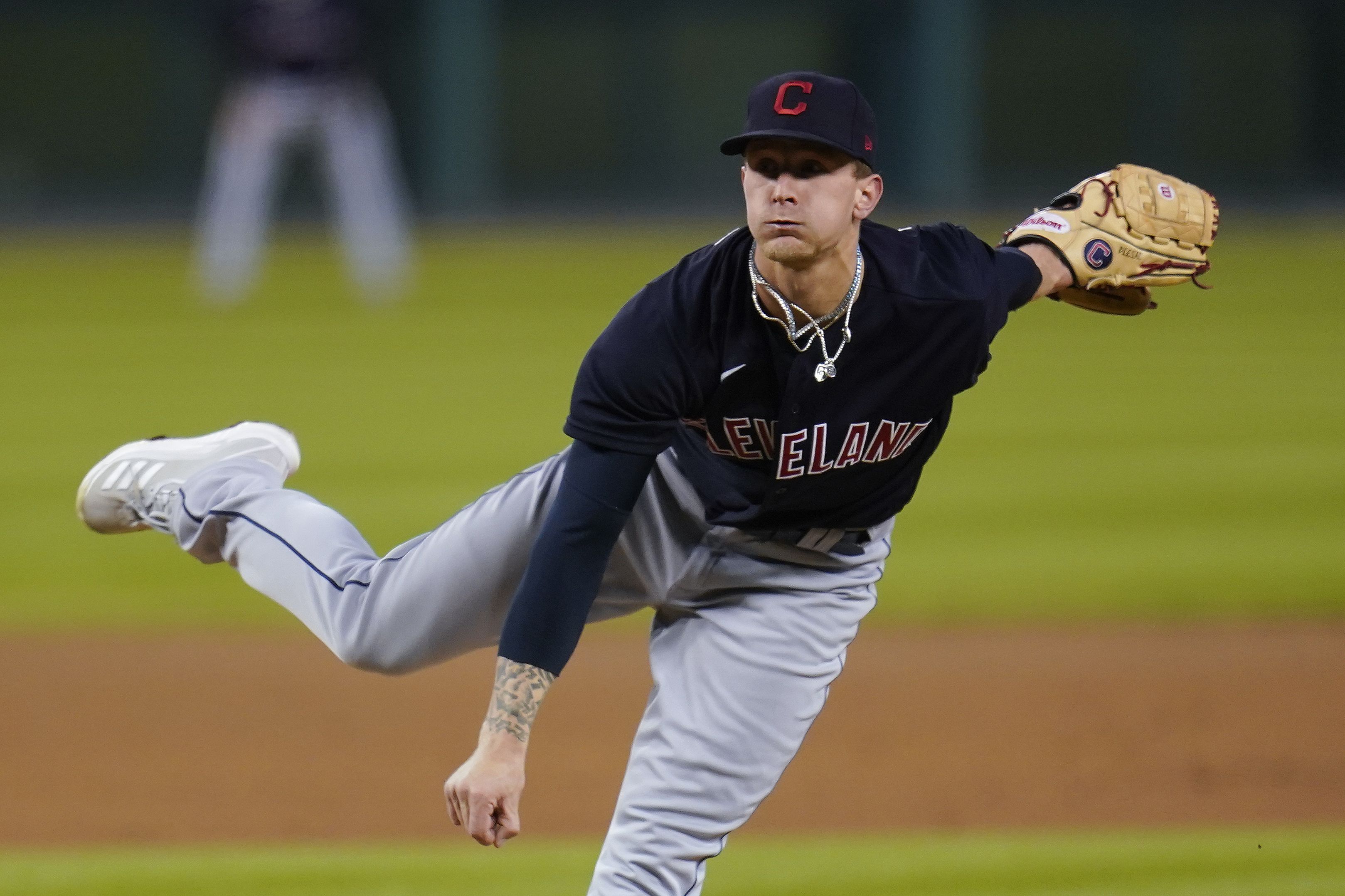 CLEVELAND, OH - SEPTEMBER 13: Cleveland Indians pitcher Mike Clevinger (52)  delivers a pitch to the plate during the first inning of the Major League  Baseball game between the Detroit Tigers and