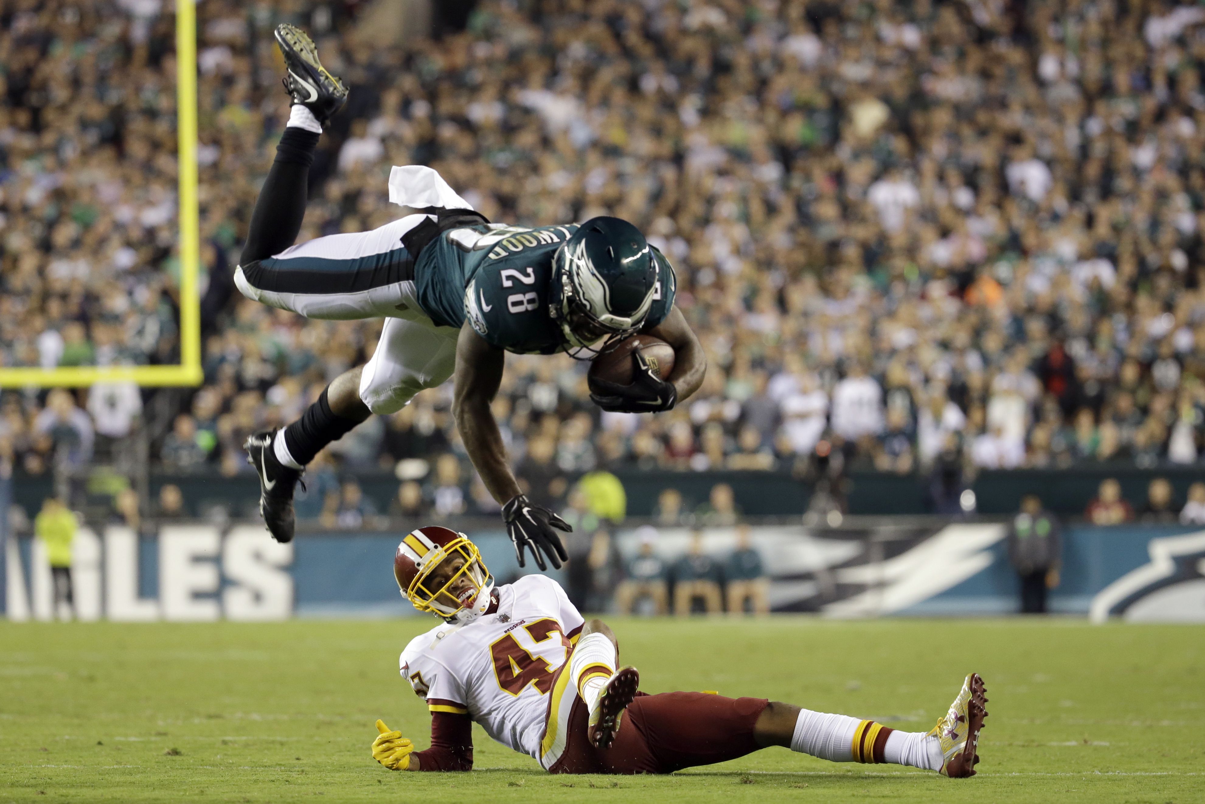 Philadelphia Eagles running back Wendell Smallwood (28) hurdles