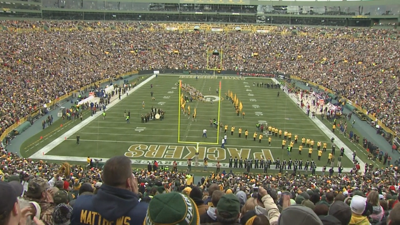 View of Lambeau Field scoreboard with image of Lombardi trophies