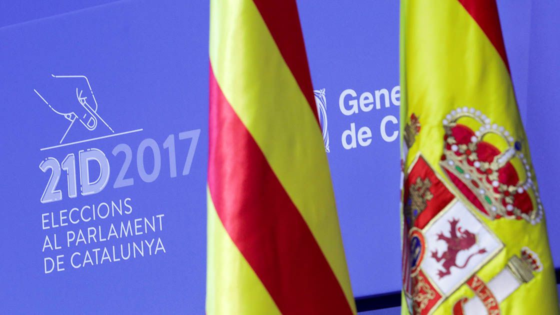 Spanish and Catalan flags are displayed in the main press center for tomorrow's regional elections in Barcelona