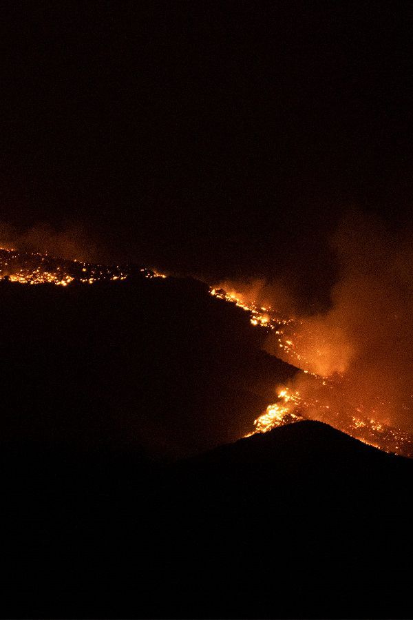 The Cameron Peak Fire, the largest wildfire in Colorado history, works through the trees outside Loveland, Colo. on Saturday,