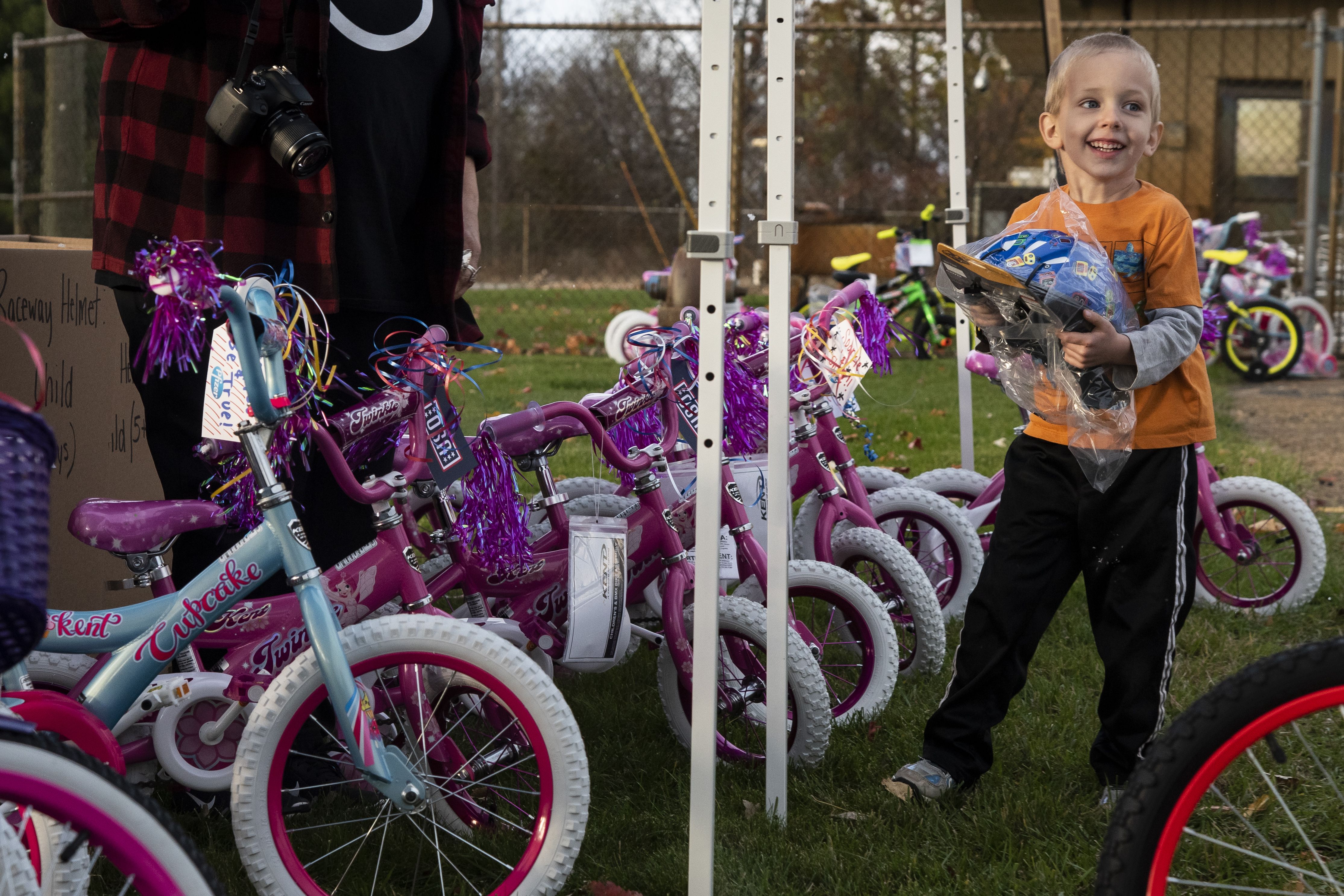 Pfizer employees in Portage build 100 bikes for military families