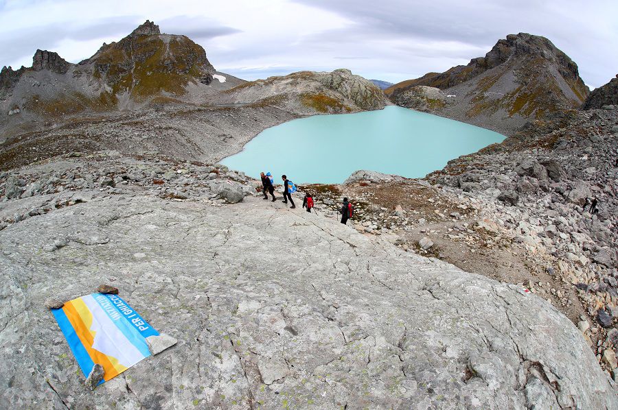 Hikers-walk-past-a-fla-3297717.jpg