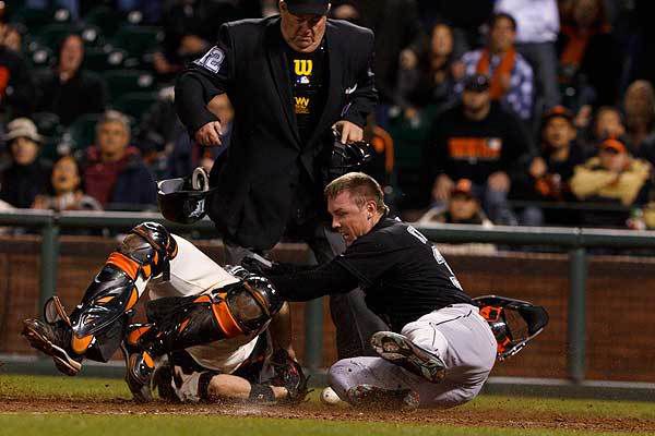 Marlins Anniversary: Scott Cousins runs over Buster Posey for