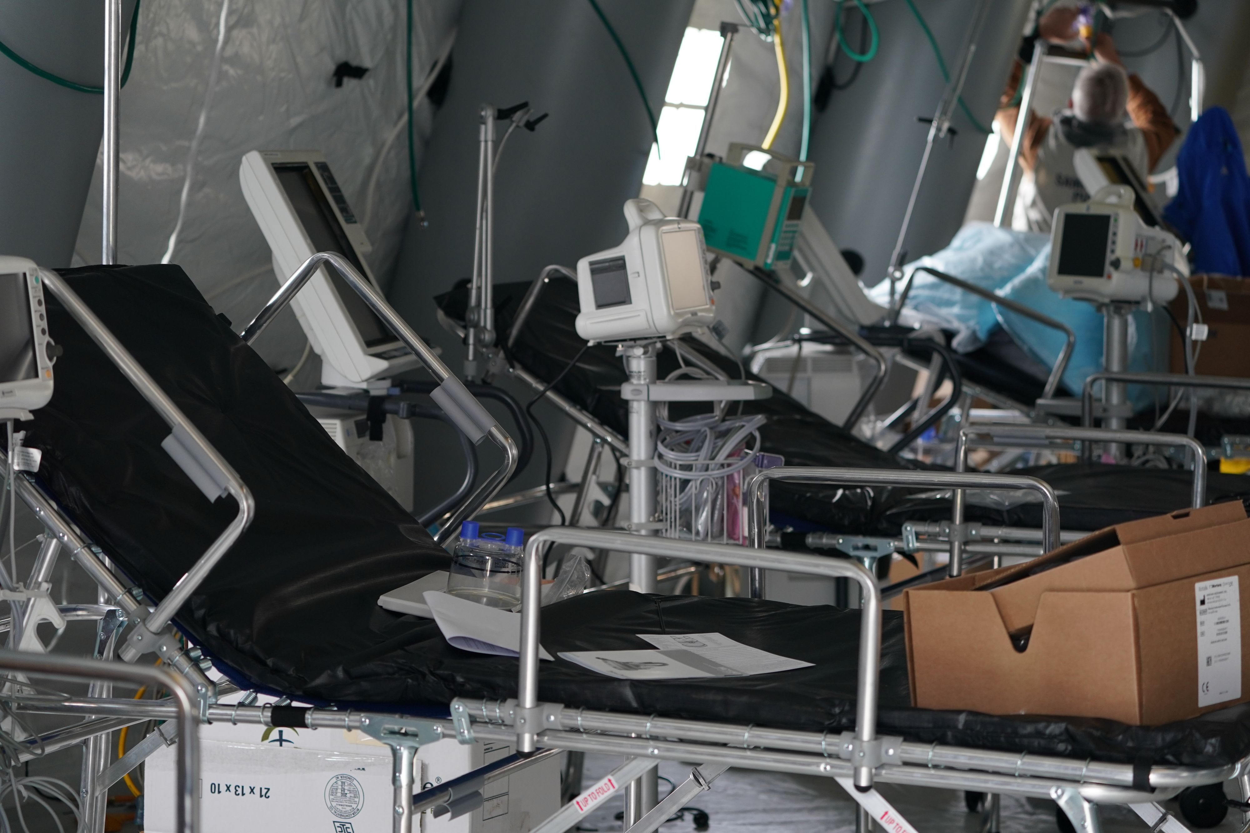 Medical supplies and beds are seen inside a tent as volunteers from the International Christian relief organization Samaritan’s Purse set up an Emergency Field Hospital for patients suffering from the coronavirus in Central Park across Fifth Avenue from Mt. Sinai Hospital on March 30, 2020 in New York. (Photo by Bryan R. Smith / AFP)