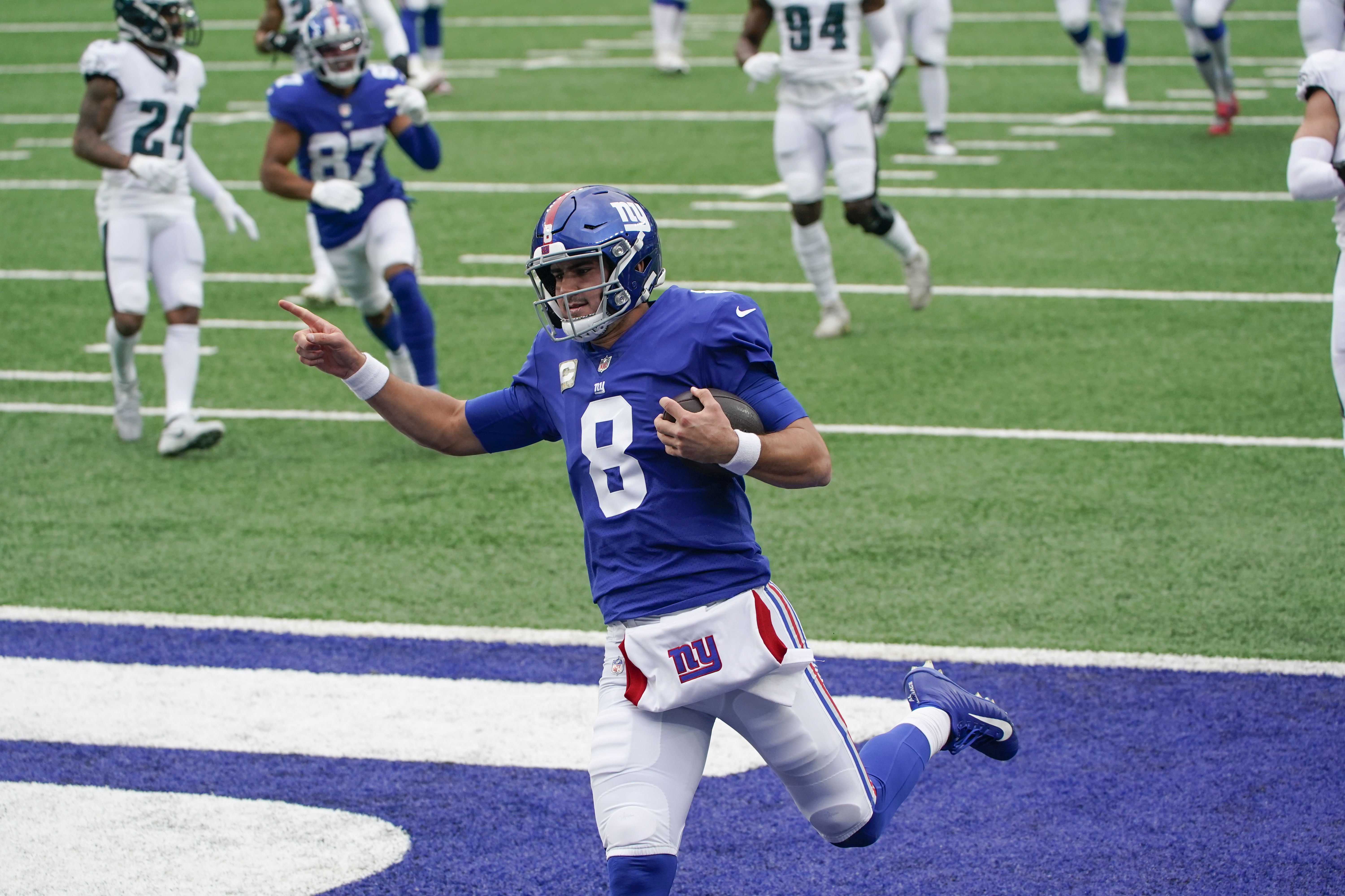 Teammates tip their helmets to Daniel Jones