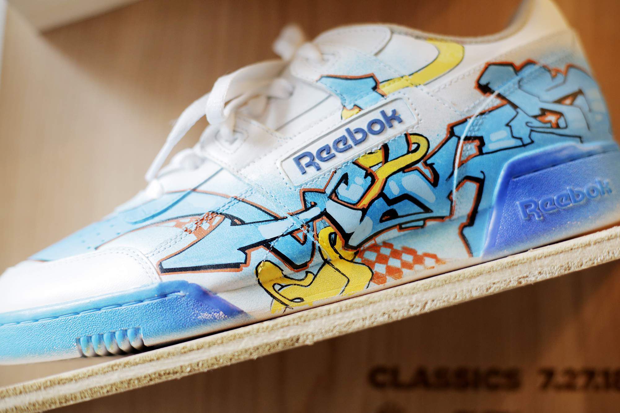 Legendary graffiti artists painted sneakers to sell display in (with