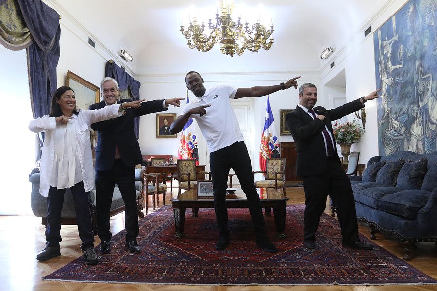 Sebastián Piñera y Usain Bolt