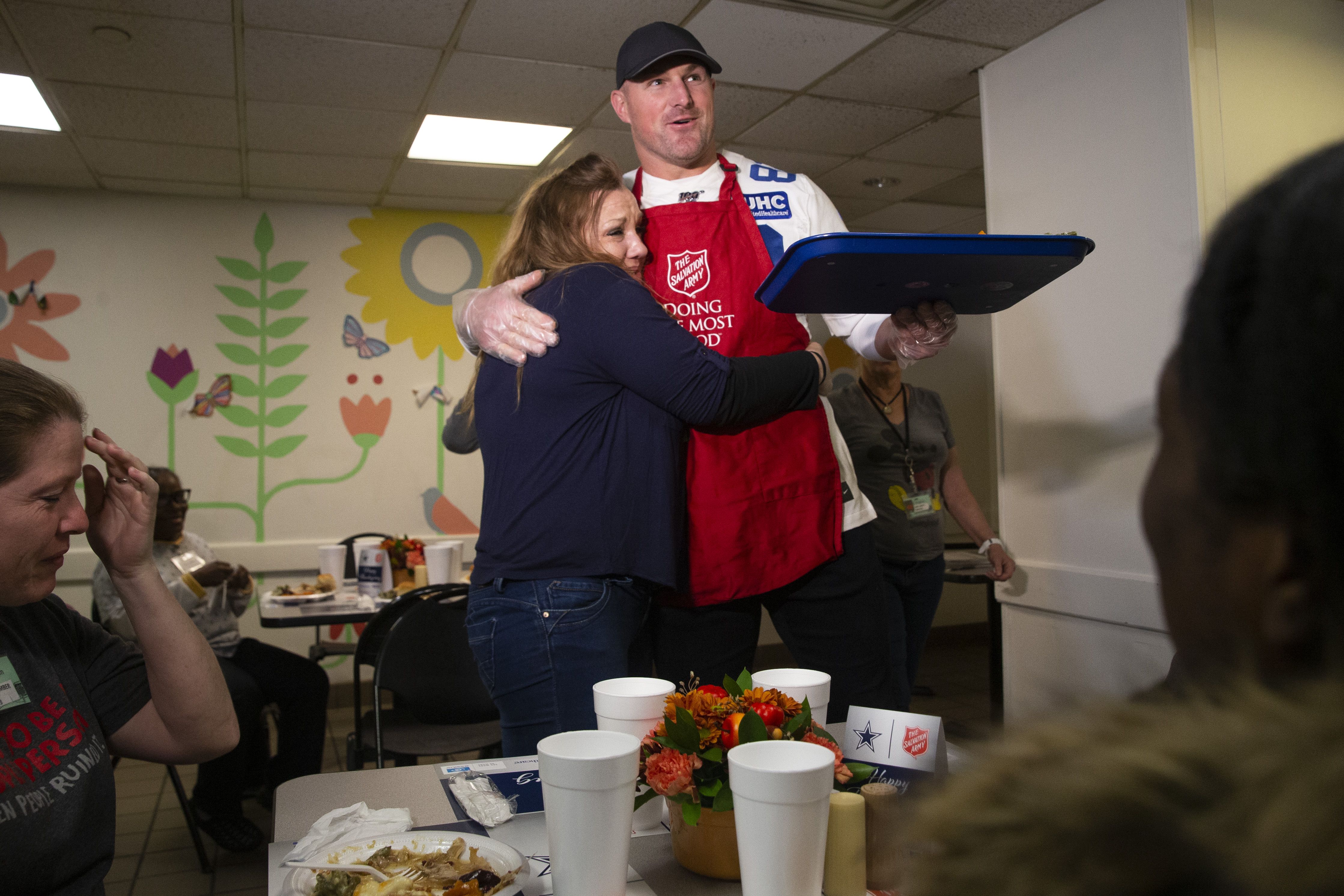 The Dallas Cowboys serve an early Thanksgiving meal at Salvation Army 