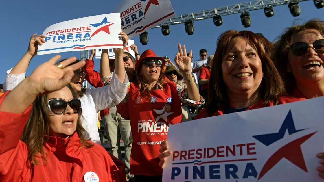 People gather to attend Sebastian Pinera's final meeting in Santiago