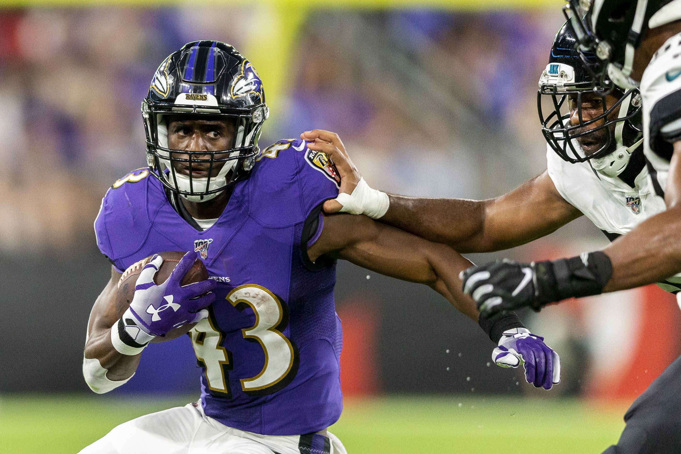 Baltimore Ravens running back Justice Hill (43) warms up before an