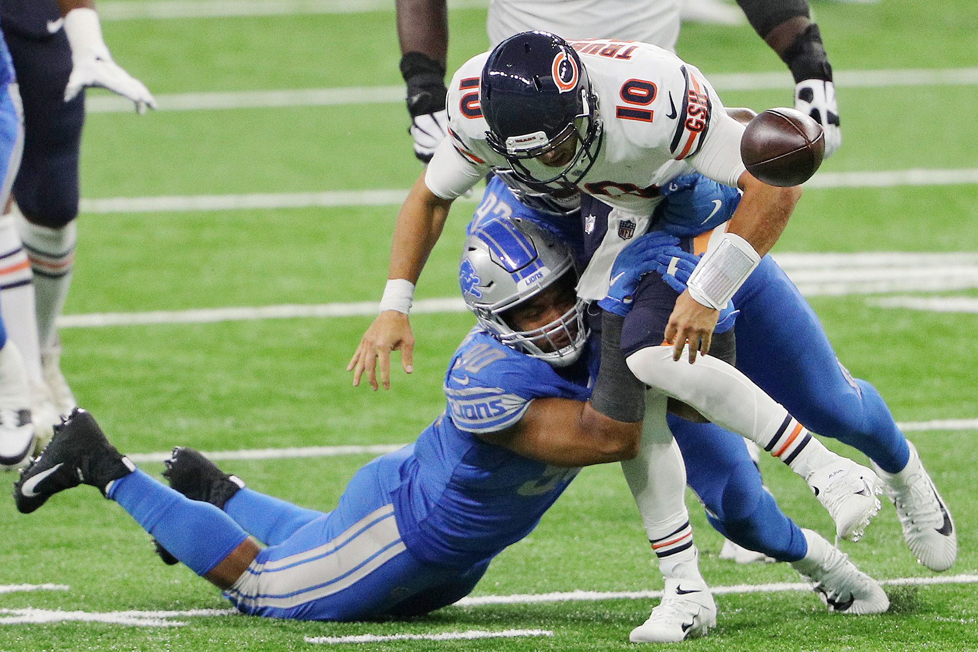 Atlanta Falcons wide receiver Julio Jones (11) is tackled by Detroit Lions  strong safety Duron Harmon (26) and defensive back Tracy Walker (21) during  the second half of an NFL football game