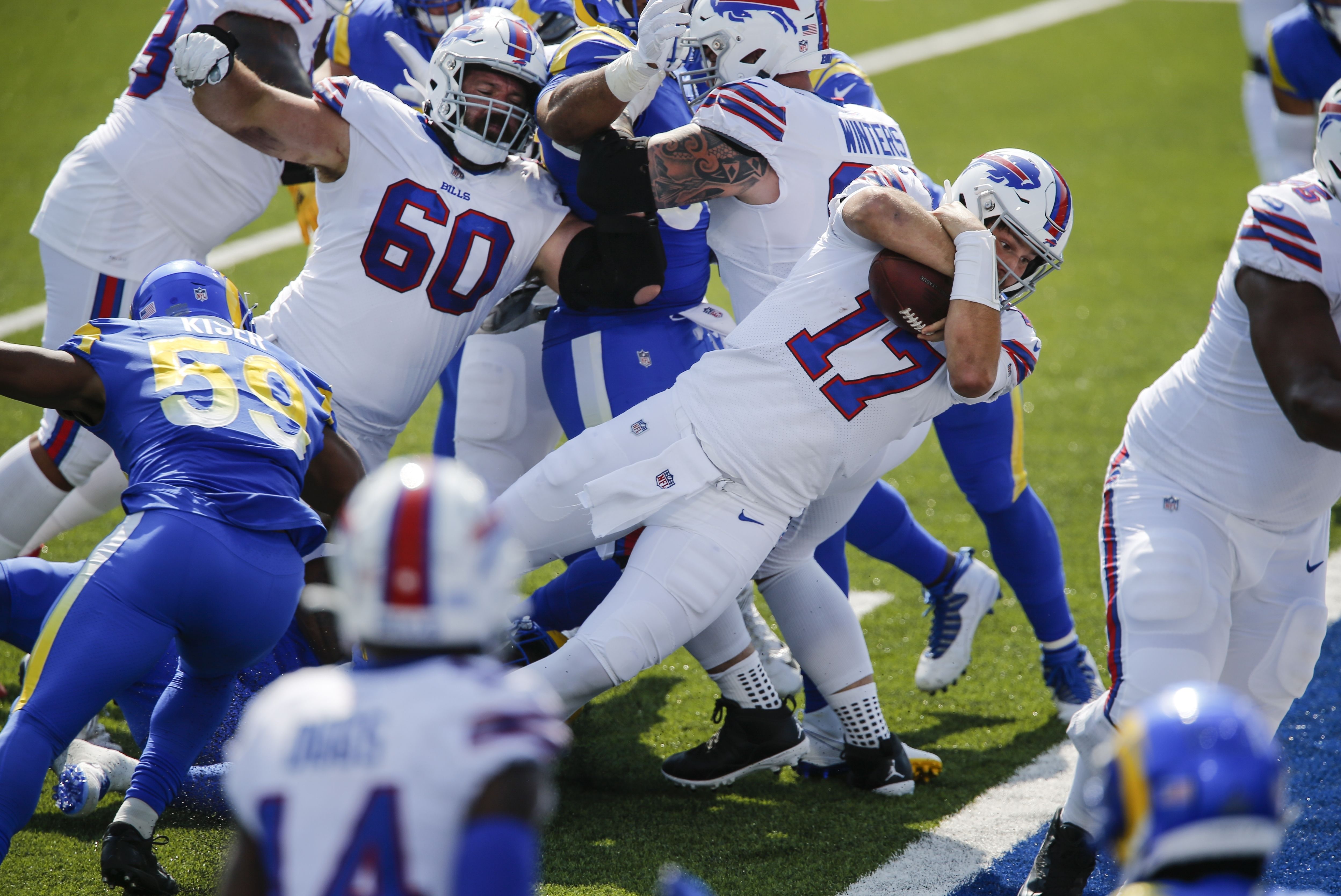 Dawson Knox of the Buffalo Bills catches a pass in front of Justin