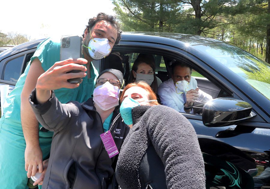 New York State Governor Andrew Cuomo stops his car to take a selfie with David Bass, Maria Clara Lorca, and Dawn Spatz, all