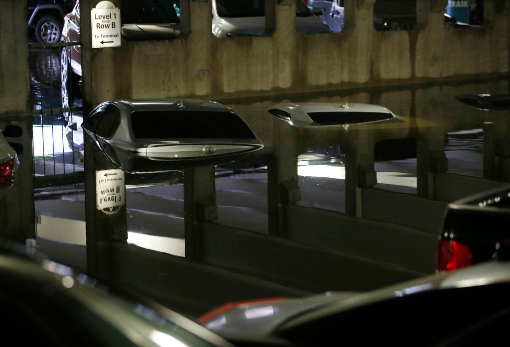 Parking Garage At Dallas Love Field Floods After Heavy Storms