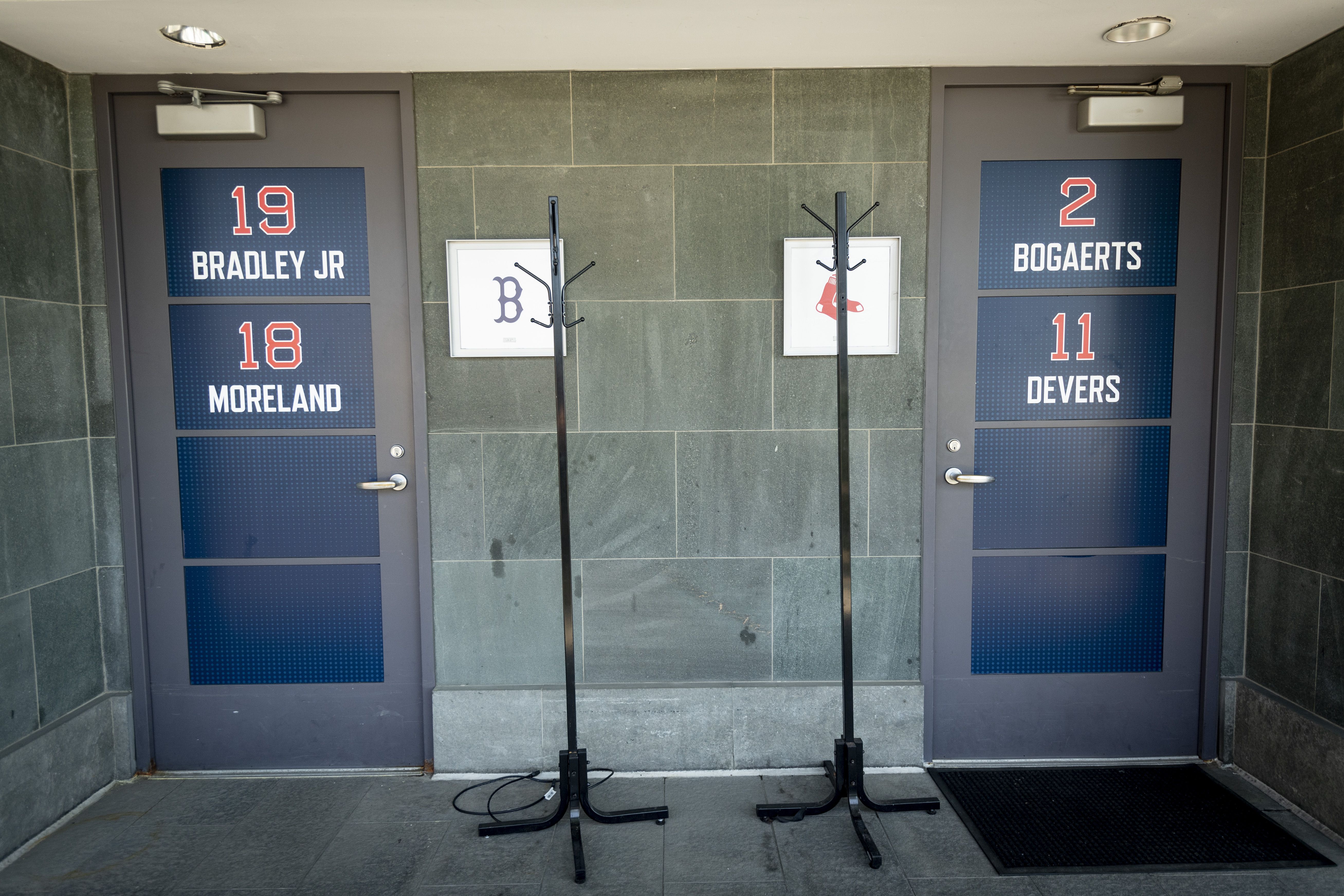 Clubhouse attendant packs up Red Sox gear, at Fenway - Digital Commonwealth