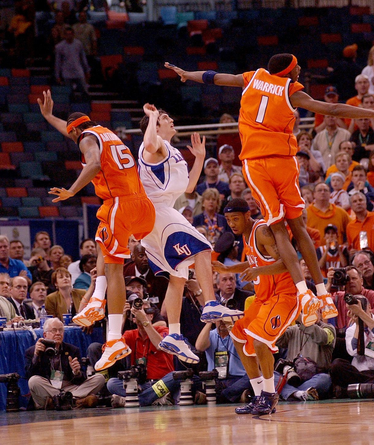 Kansas' Kirk Hinrich puts up a shot and is fouled by Syracuse's Kueth Duany  in the second half of the championship game at the Final Four Monday, April  7, 2003, in New