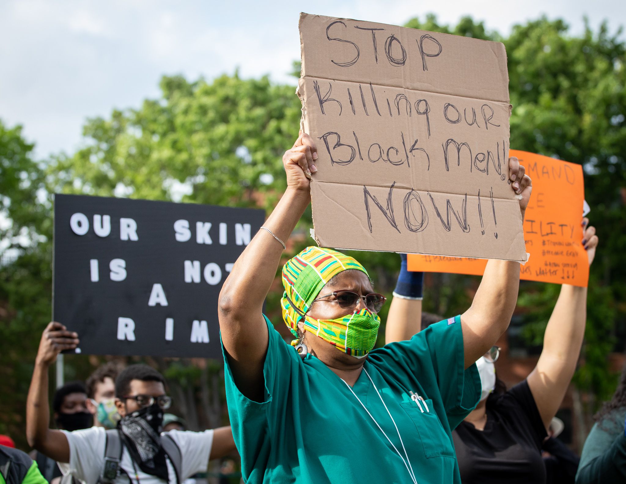 Protestors unfurl 'No ICE, No prisons, No More Cages' banner over Green  Monster at Fenway Park 