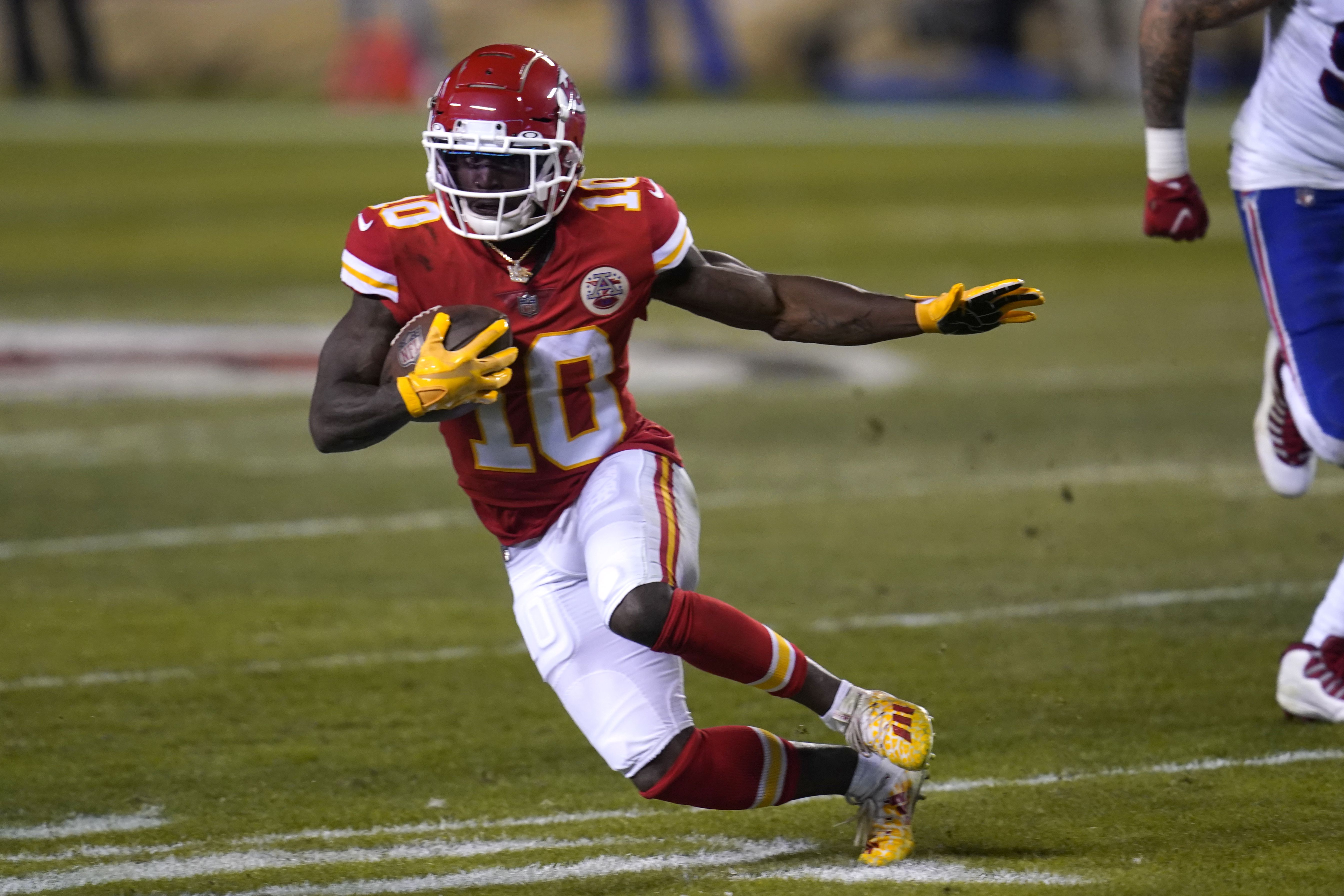 Kansas City, United States. 19th Jan, 2020. Kansas City Chiefs quarterback  Patrick Mahomes (15) flexes his muscles after a scoring a touchdown on a  twenty seven yard run against the Tennessee Titans