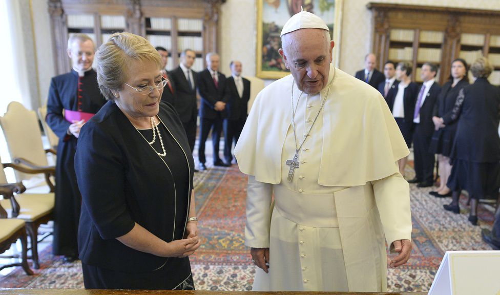 Pope Francis exchanges gifts with Chile's President Michelle Bachelet during a private audience at the Vatican