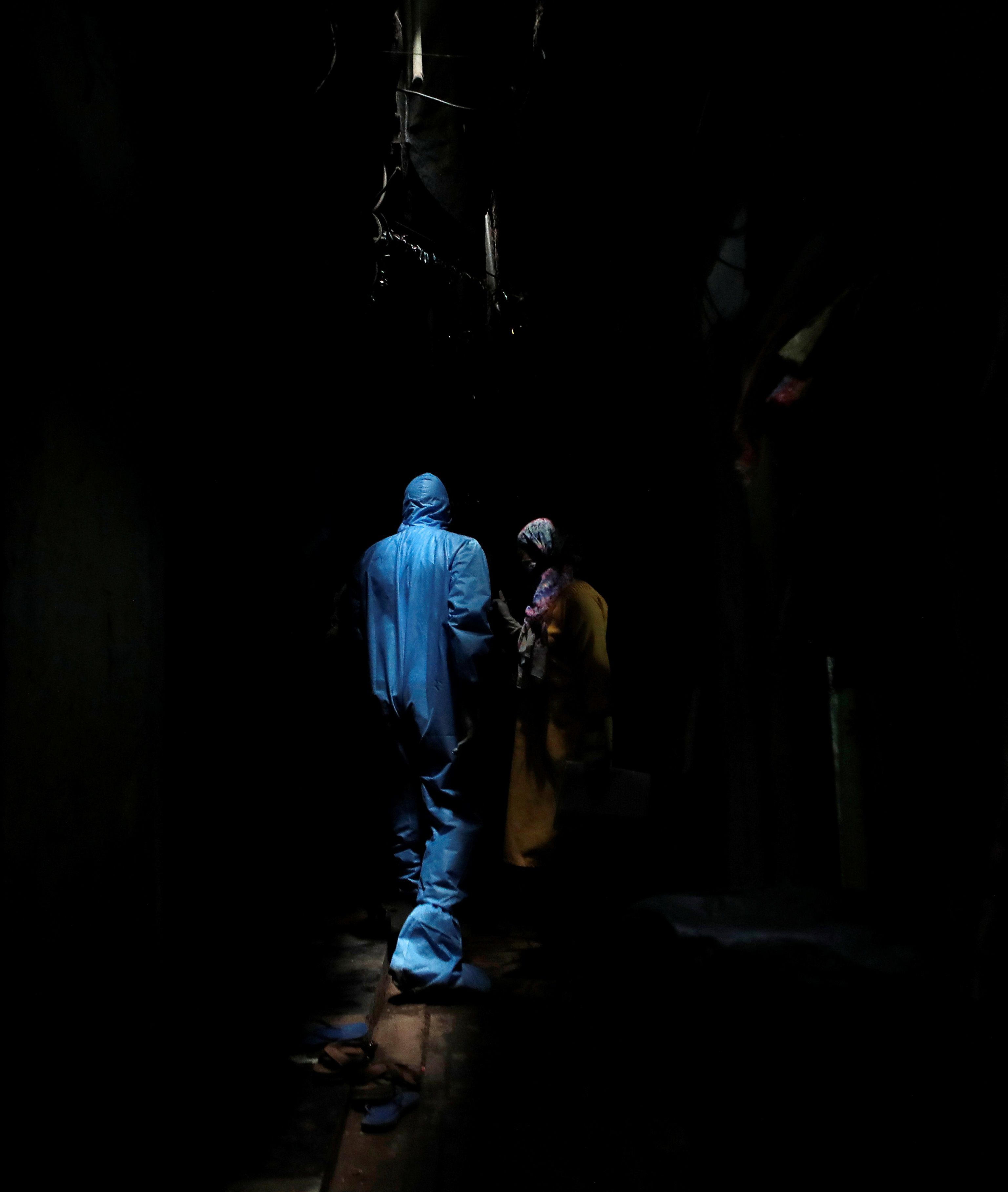 The Wider Image: Indians build their own lockdown barricades in the country's slums