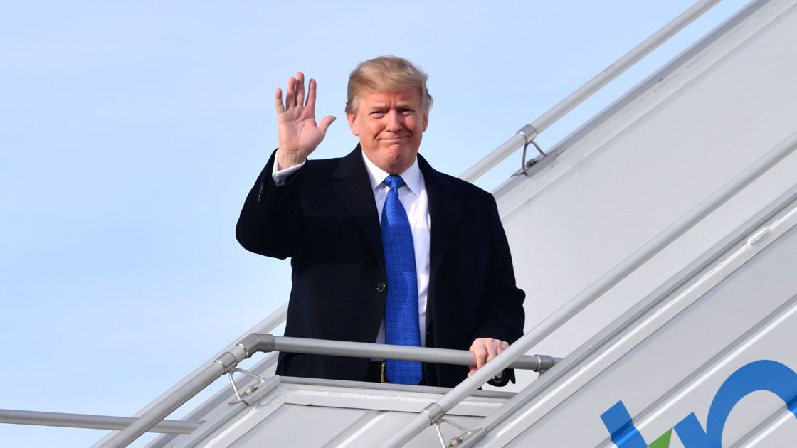 EDITORS NOTE: Graphic content / US President Donald Trump waves as he