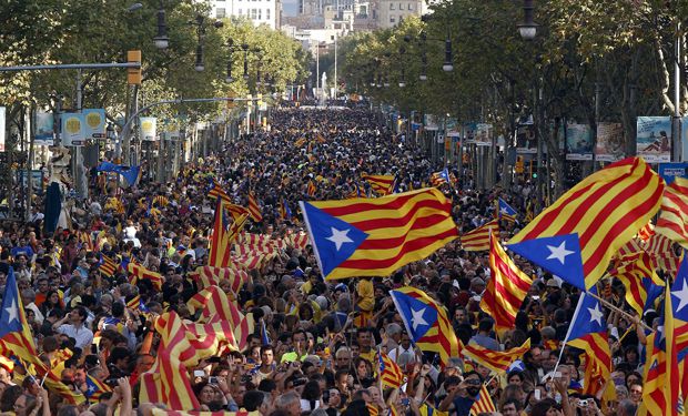 Catalan separatist flags are waved as a crowd forms a human chain to mark Catalunya's National Day in central Barcelona