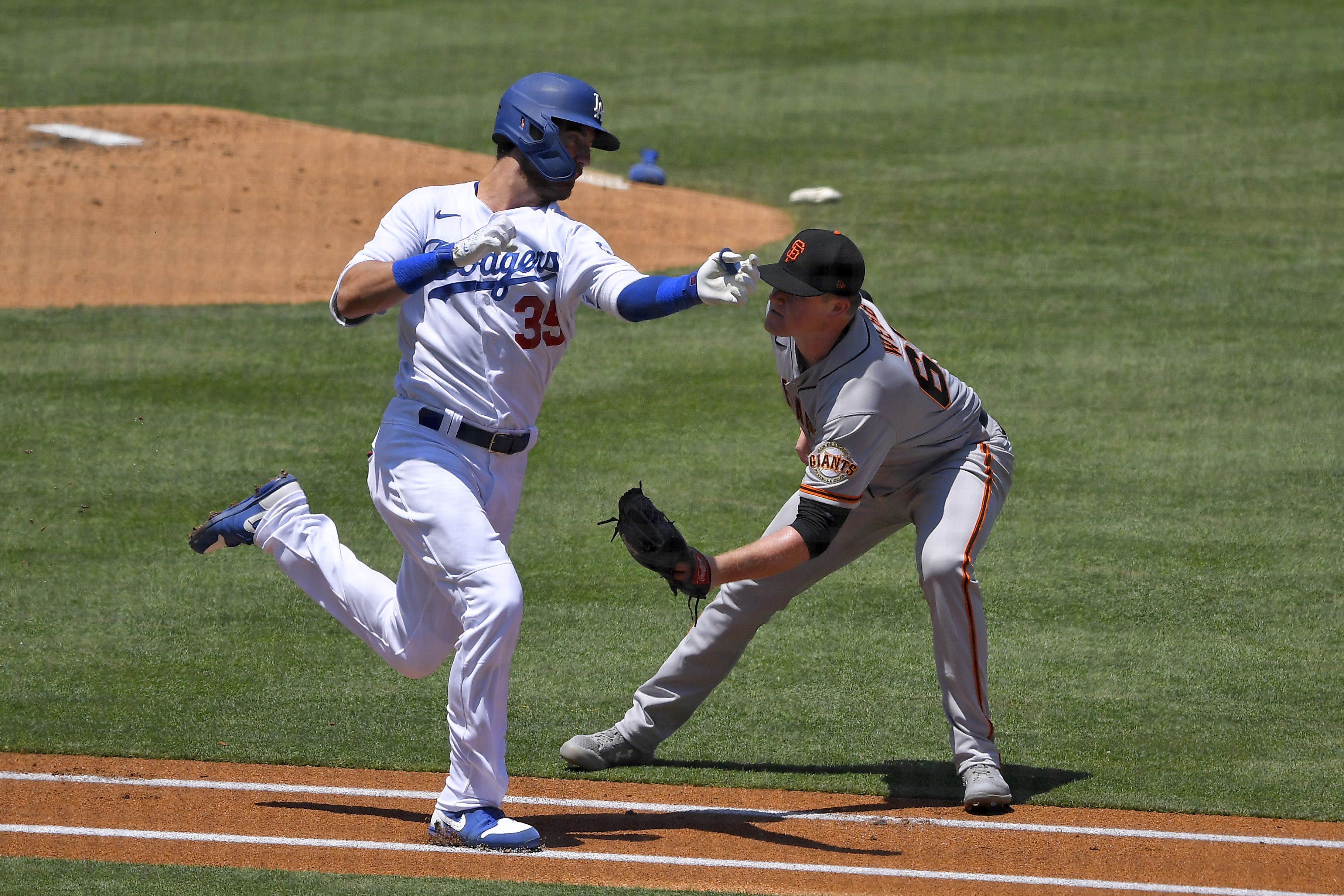 Justin Turner of the Dodgers distributes back-to-school backpacks