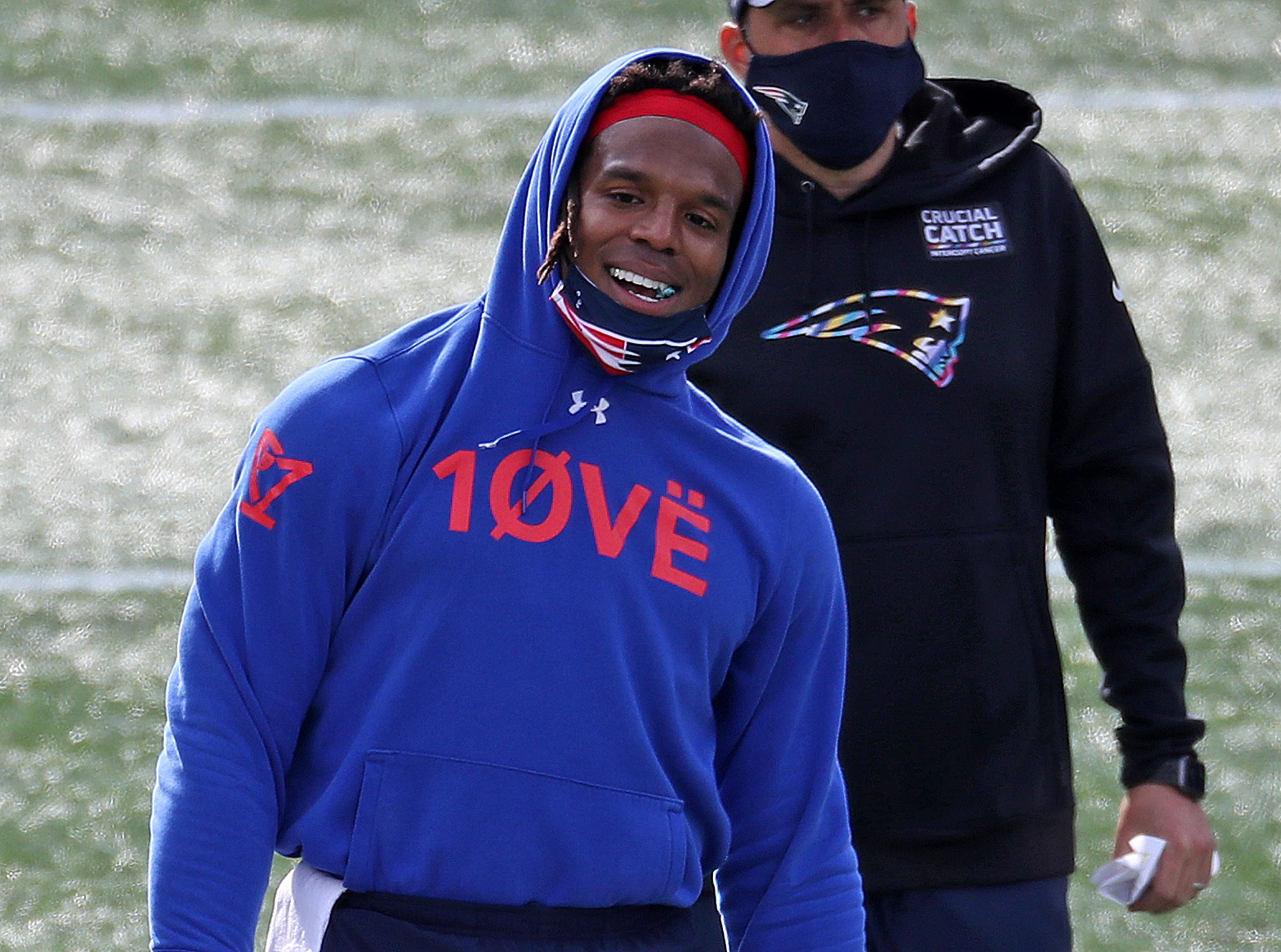 NFL MVP Cam Newton performs lewd gesture as he zings heckling fans at  football camp