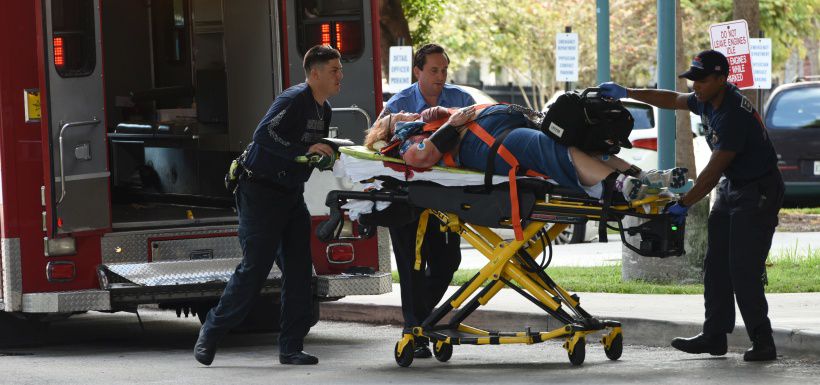 An injured woman is taken into Broward Health Trauma Center in Fort L