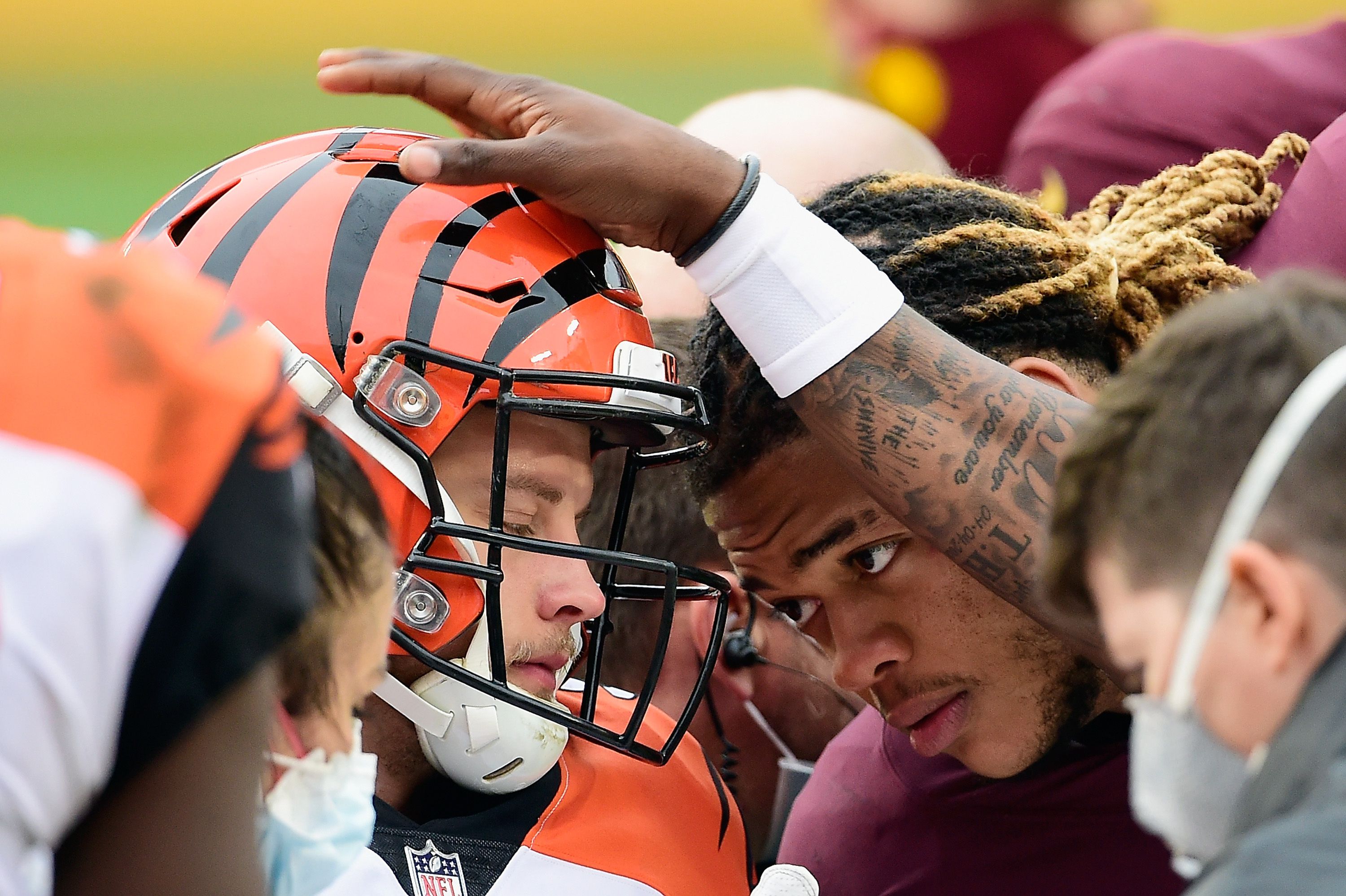 Joe Burrow injury: Bengals quarterback carted off after hit to knee