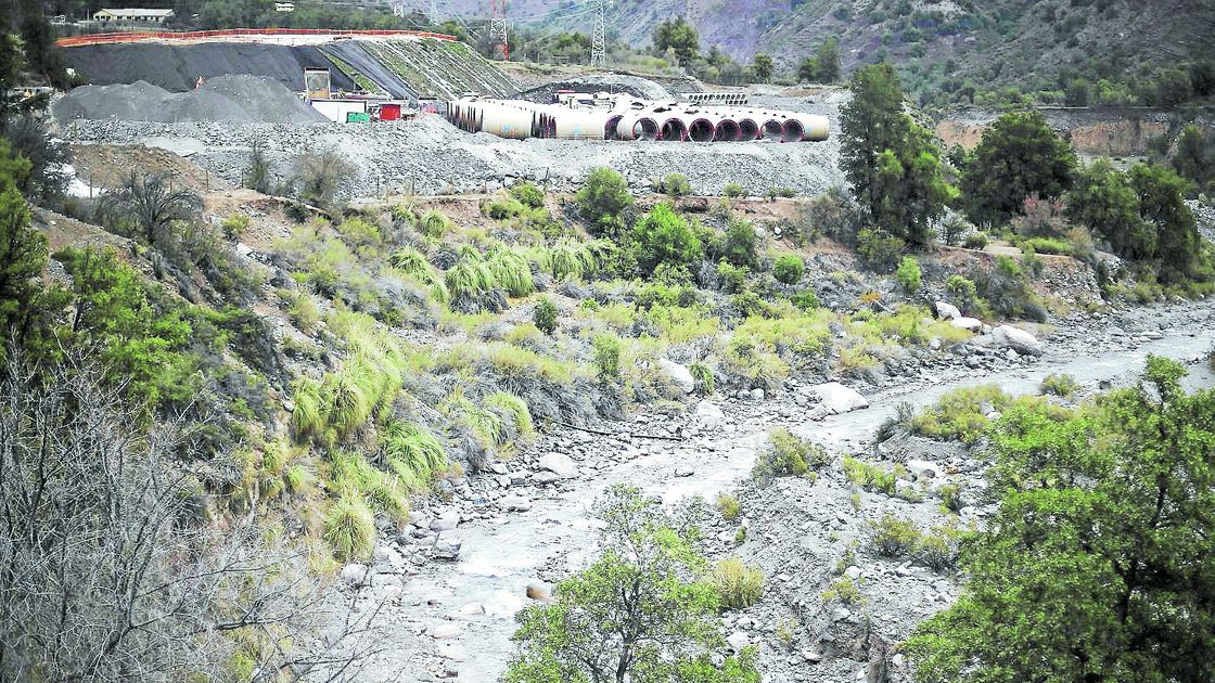 FILE PHOTO: Pipes of Alto Maipo hydroelectric project are seen next to Colorado river, in a pre-mountain range area on the outskirts of Santiago