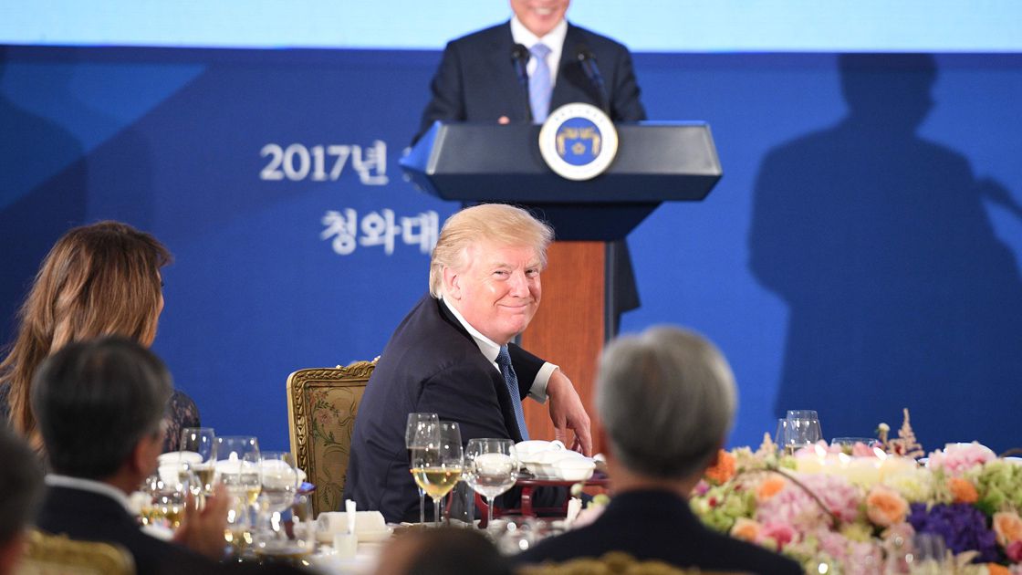 US President Donald Trump (front C) and First Lady Melania Trump (L)