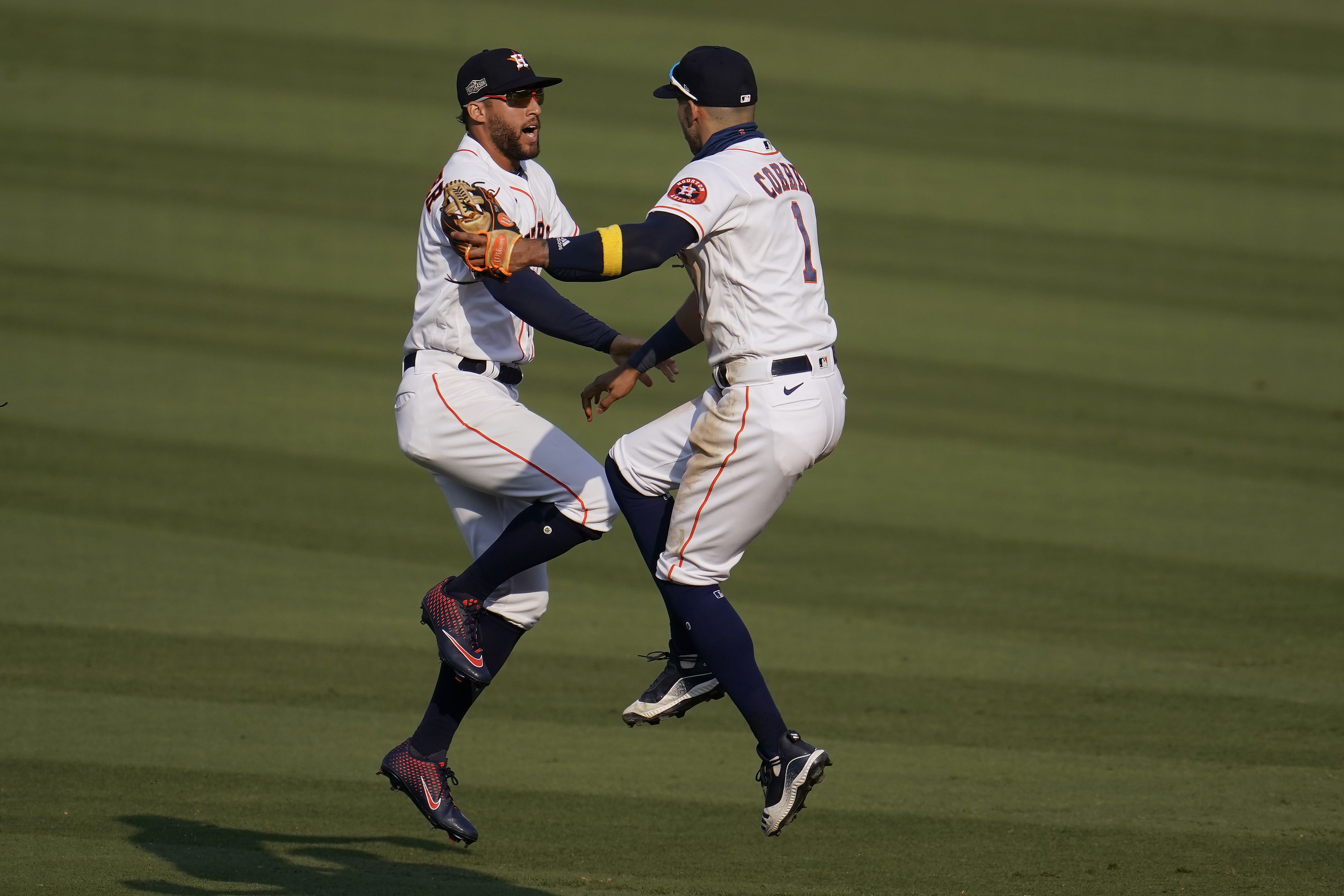 Oakland Athletics' Mike Fiers, center, celebrates with Matt Olson