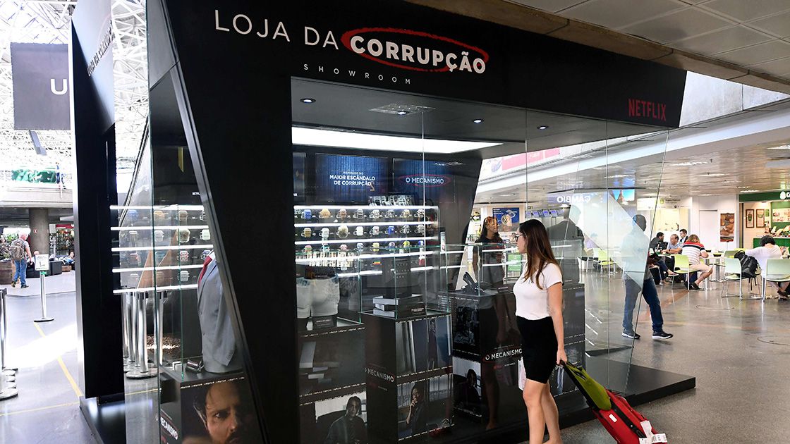 A passenger stops to take a look at the "Corruption Shop"