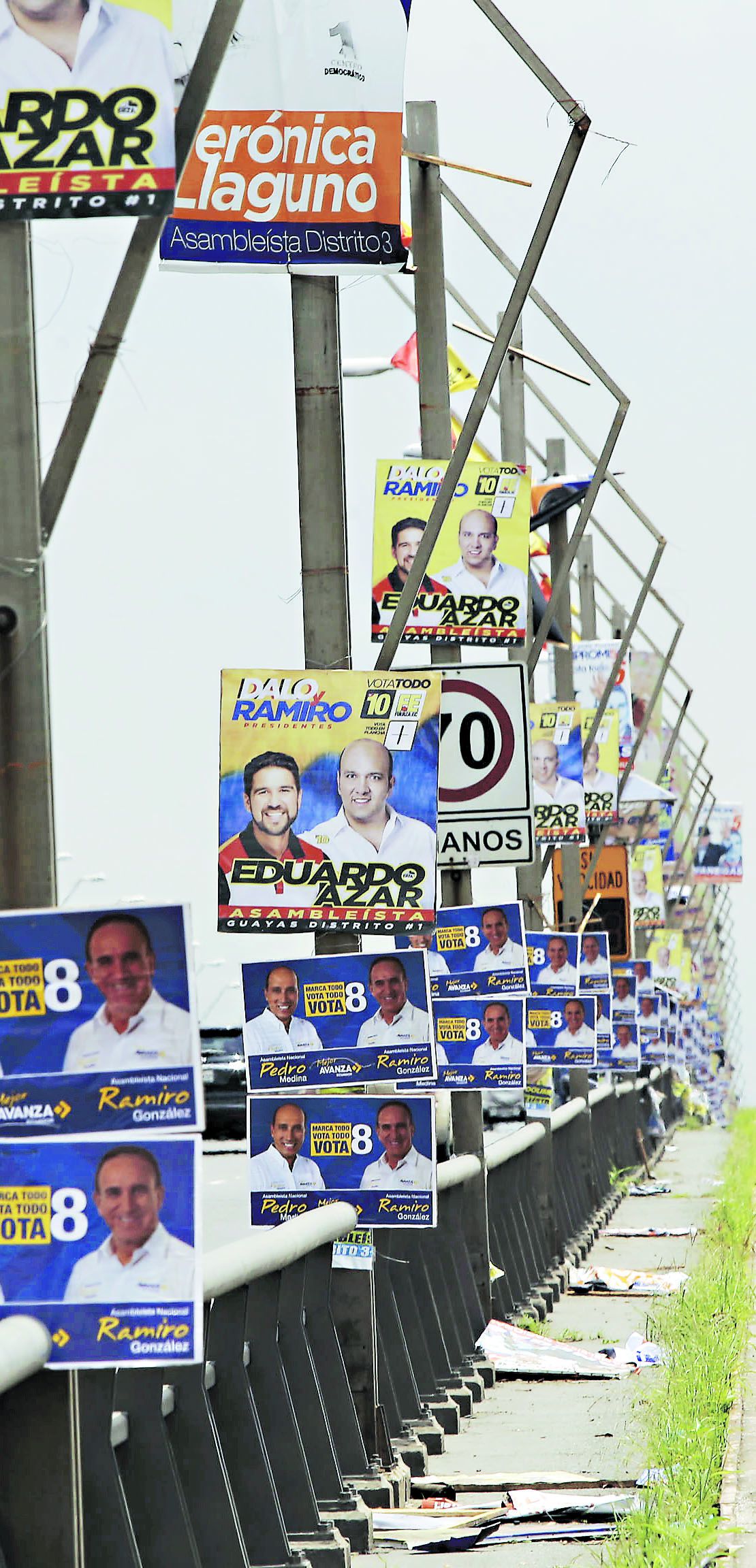 Propaganda of Ecuadorean presidential candidates hangs from lighting