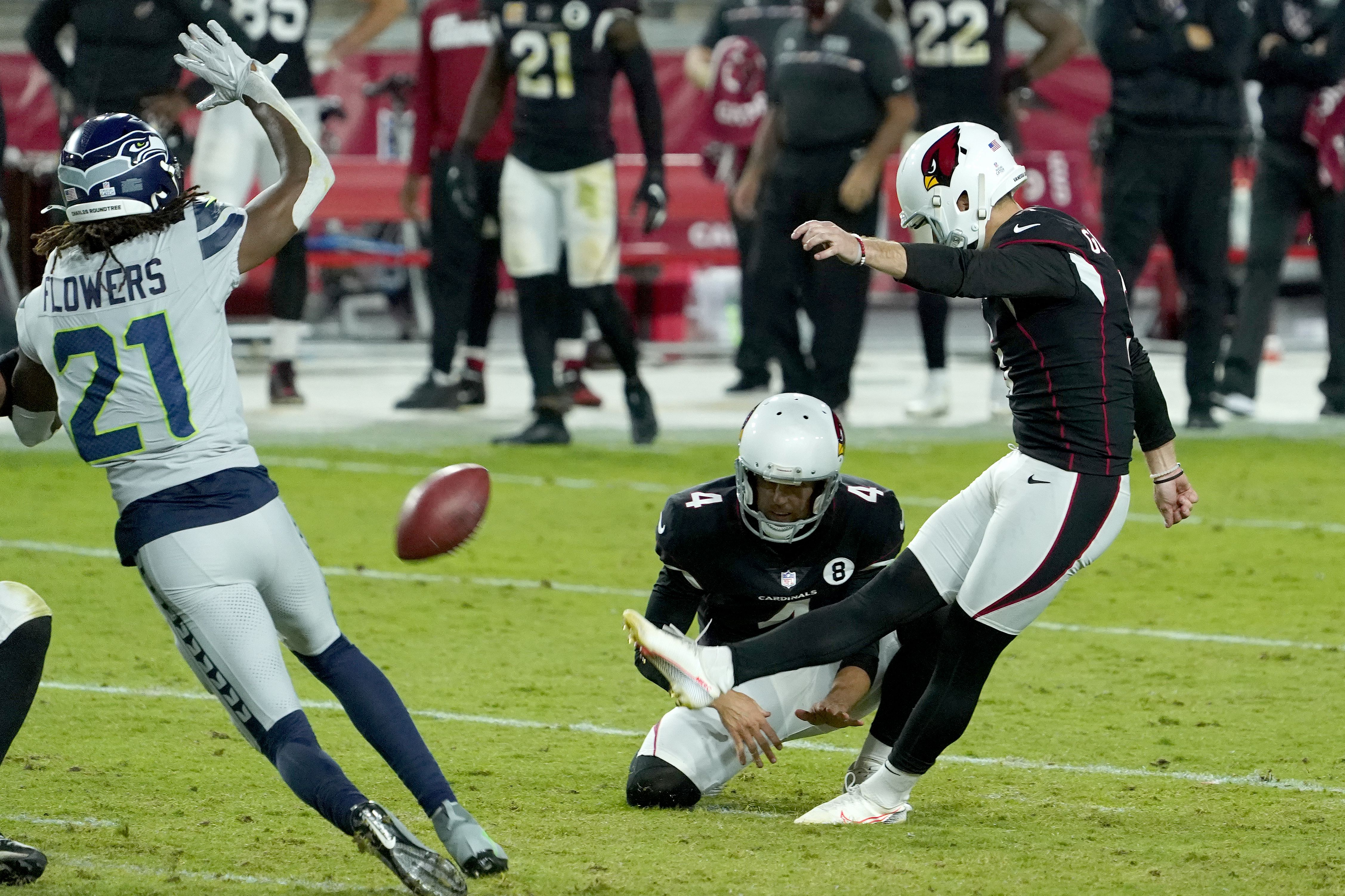 Cardinals' Budda Baker leaves field on stretcher after helmet-to