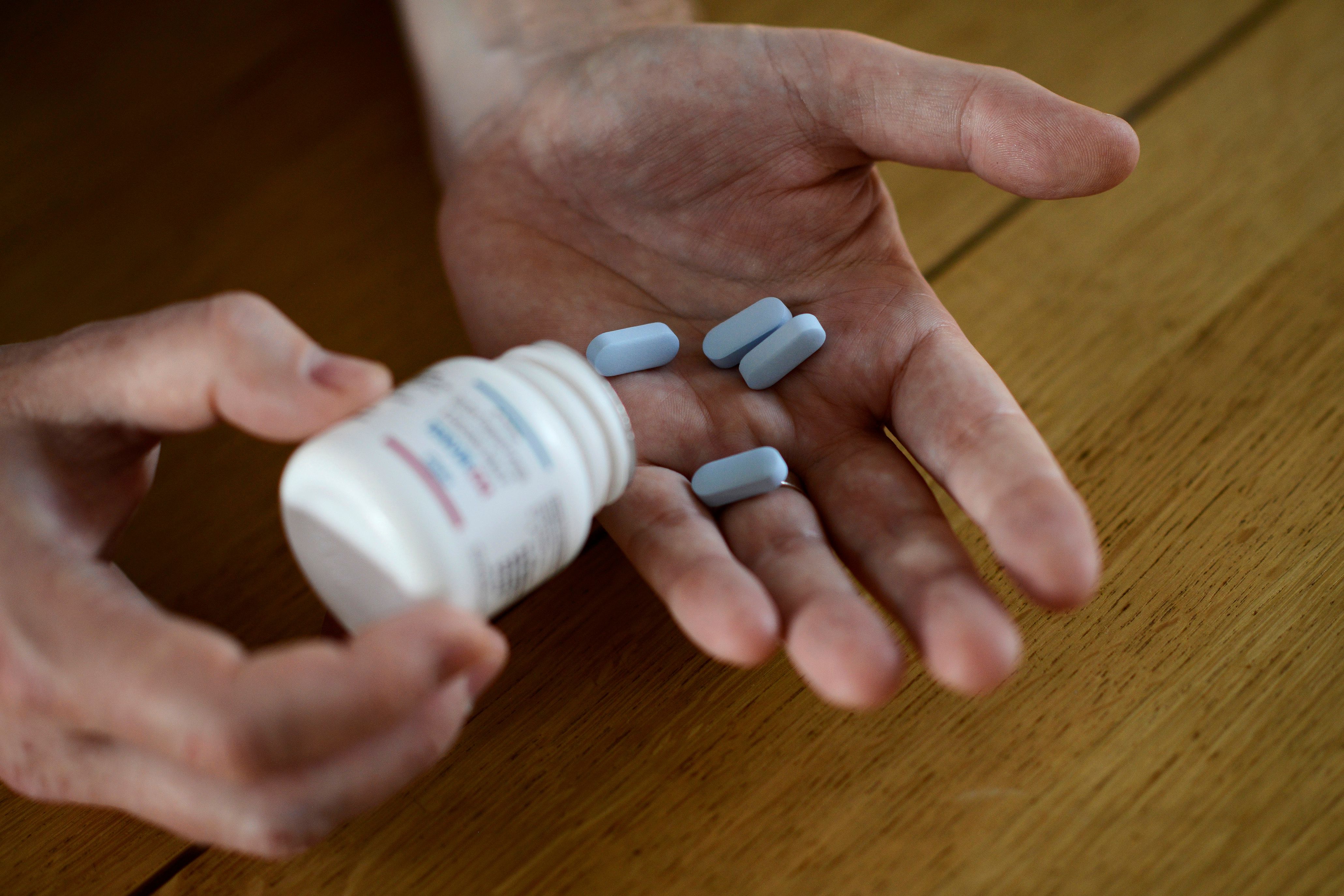 Nutland shows off some of his generic drugs during an interview with Reuters at his home in central London