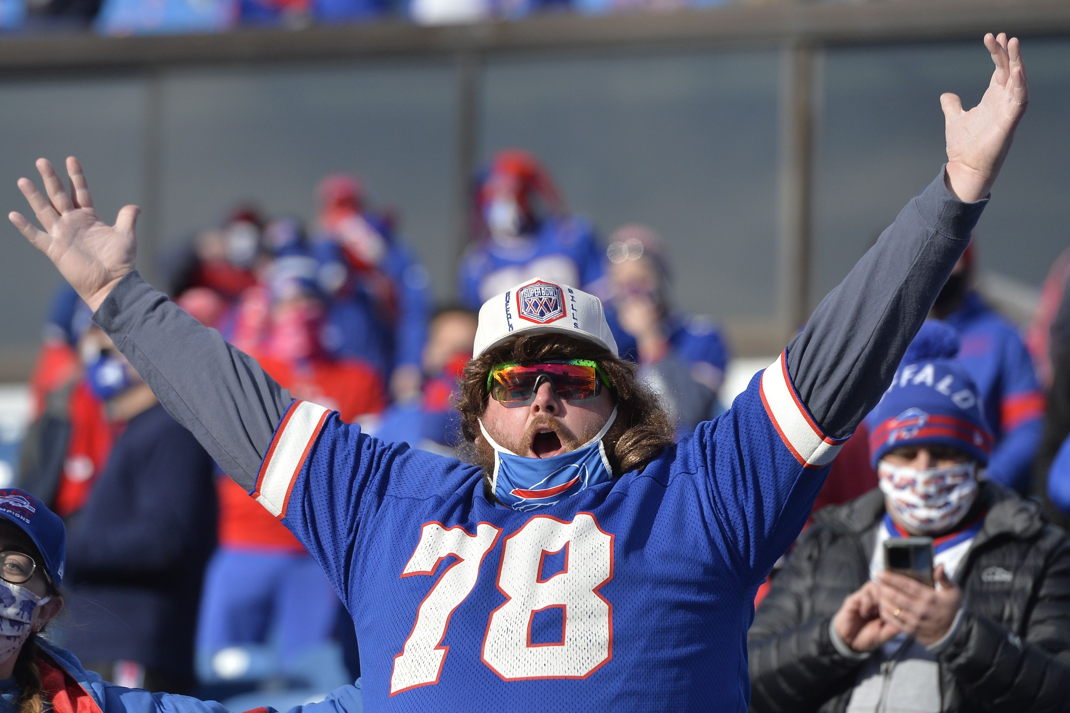 A Buffalo Bills fan cheers from the stands during the second half