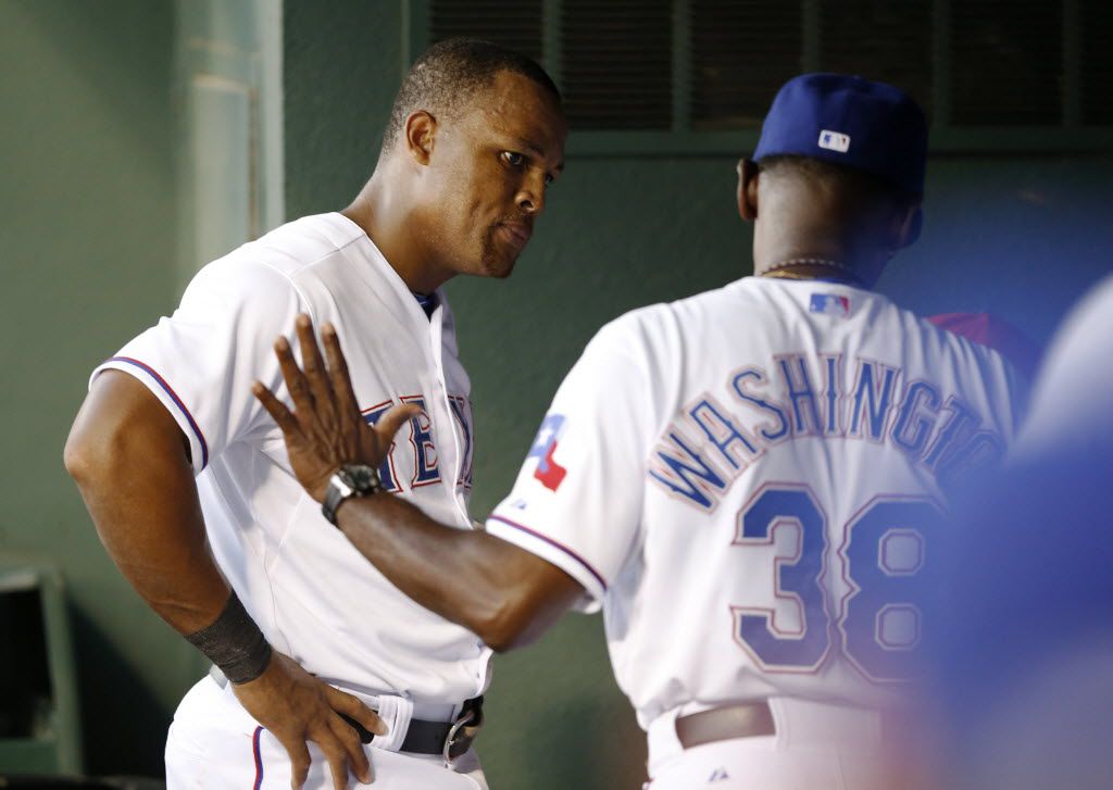 Former baseball player Adrian Beltre, left, greets former teammate Félix  Hernández after he was inducted into the Mariners Hall of Fame during a  ceremony before a baseball game between the Mariners and