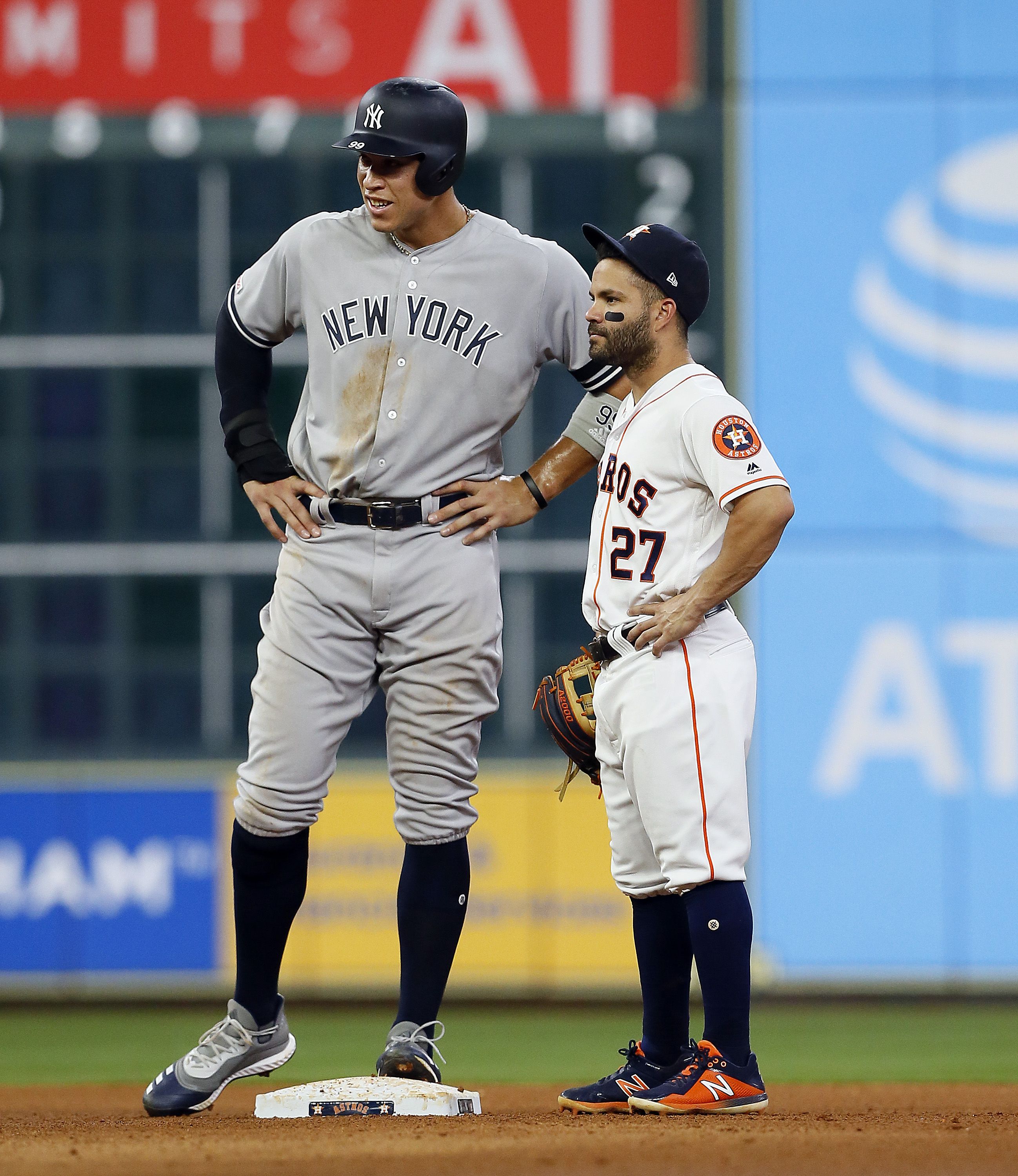 Photo: Jose Altuve stands while Yankees Aaron Judge celebrates in