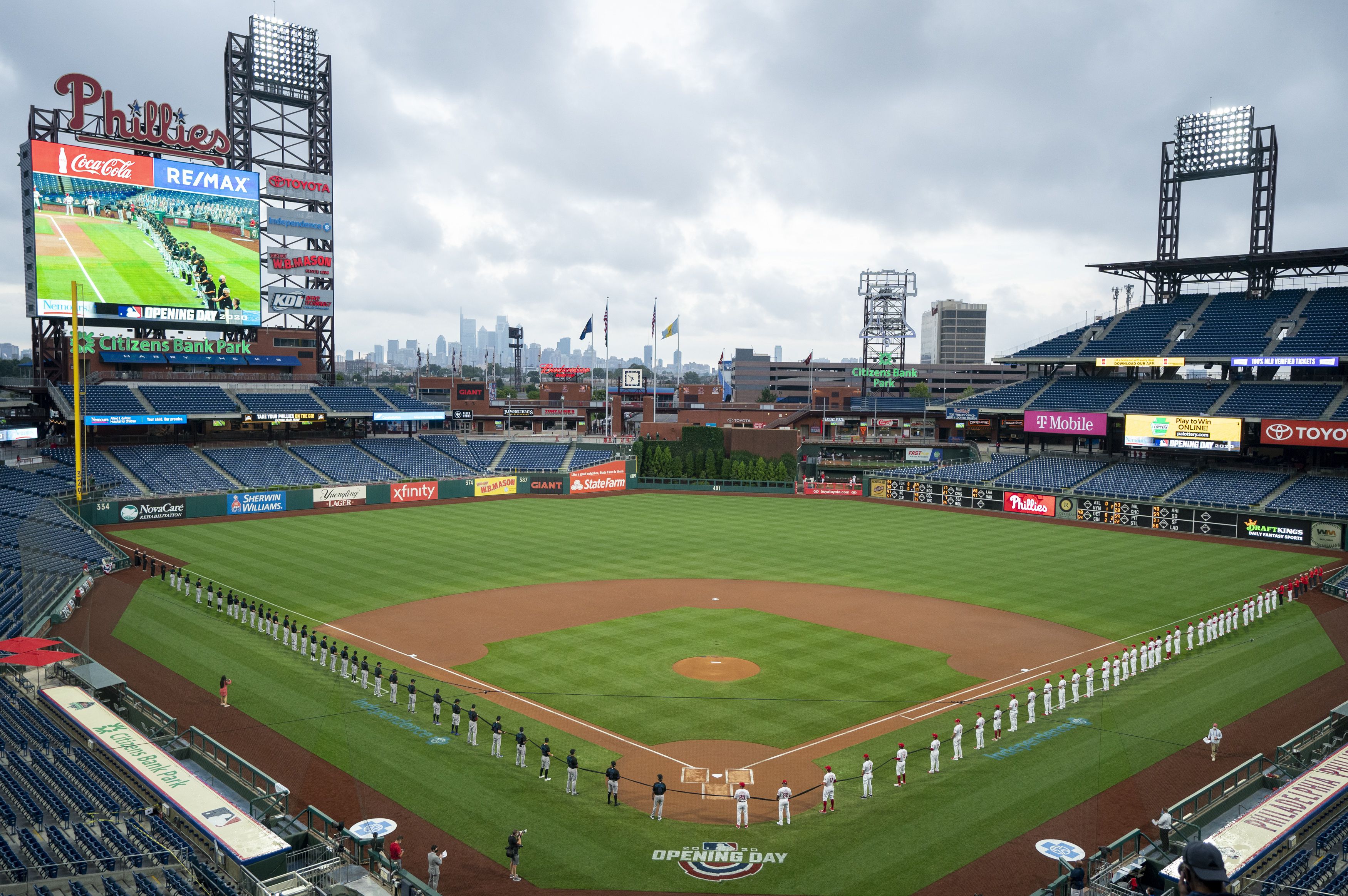 Empty stands, masked players as baseball returns