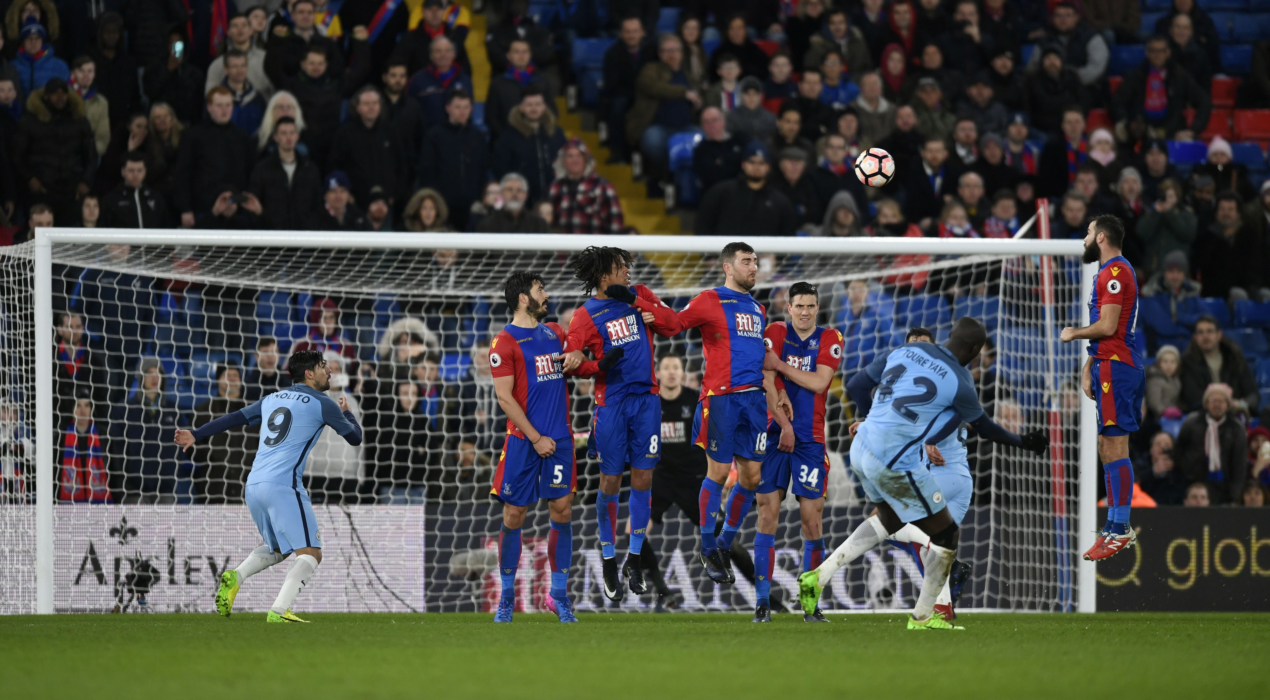 Manchester City's Yaya Toure scores their third goal from a free kick