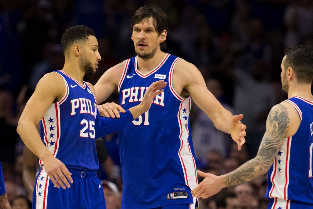 Dallas Mavericks' Boban Marjanovic shakes hands with a fan prior