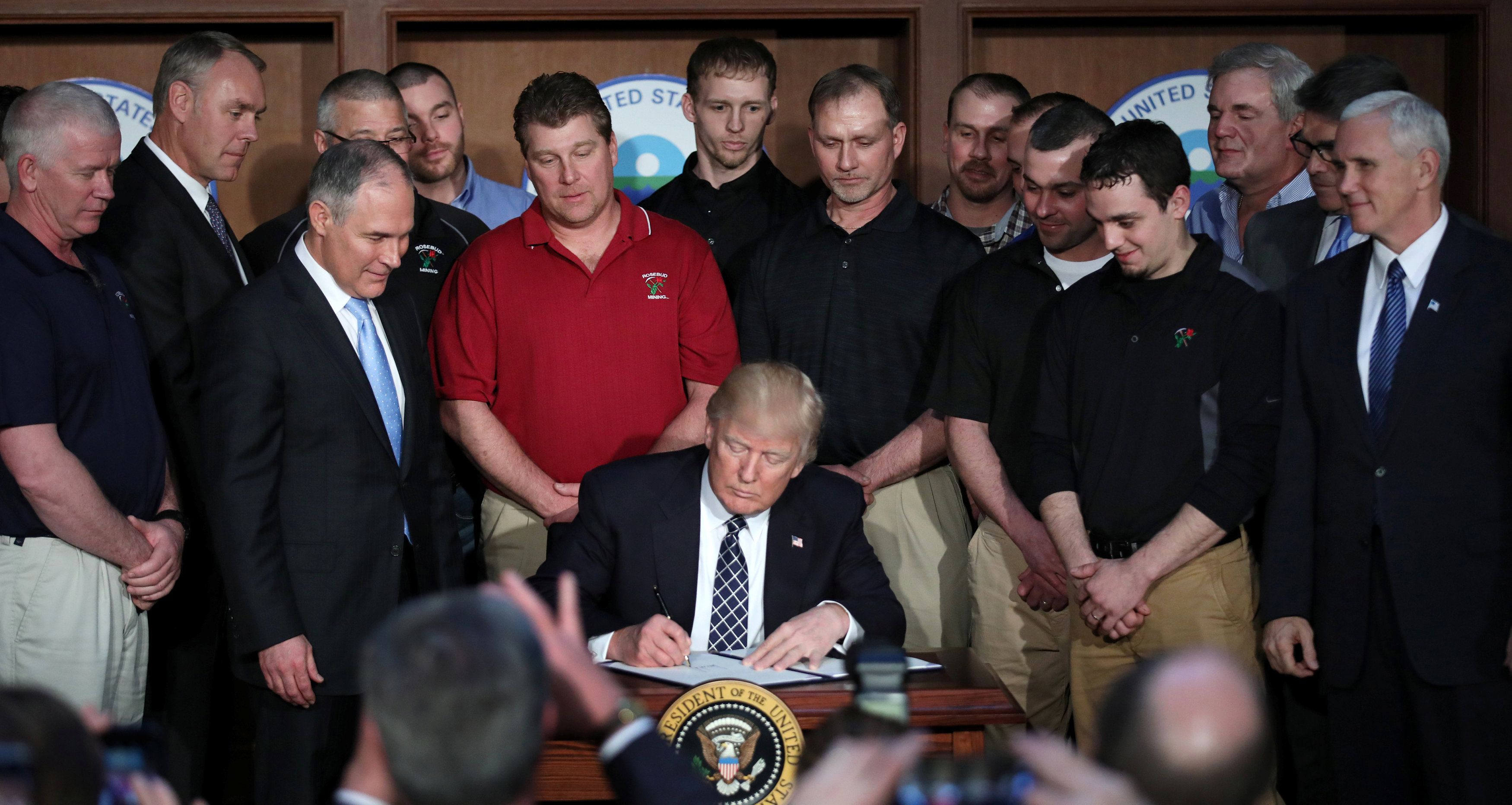 U.S. President Donald Trump reacts after signing an executive order eliminating Obama-era climate change regulations at the Environmental Protection Agency in Washington U.S.,