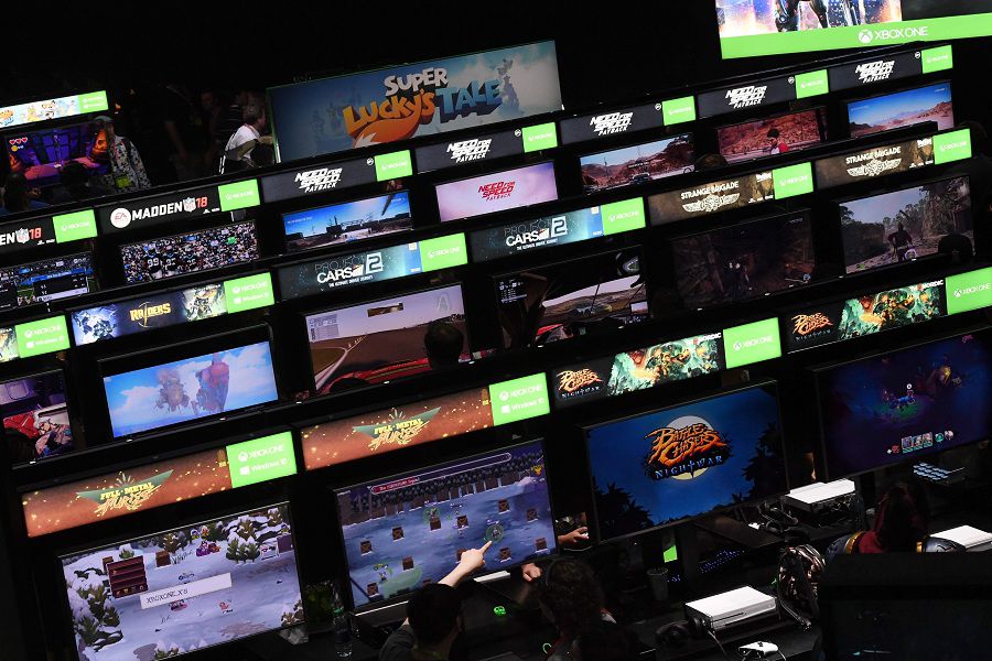 (FILES) In this file photo taken on June 13, 2017 gamers crowd the Microsoft Xbox One exhibit at the Los Angeles Convention center on day one of E3 2017, the three day Electronic Entertainment Expo, one of the biggest events in the gaming industry calendar, in Los Angeles, California. Google is looking to transform internet-age game play, with an expected launch of a streaming service which uses the tech giant's power in the internet cloud. Expected Tuesday, March 19, 2019. is the debut of a ramped-up version of a cloud gaming platform Google tested recently in partnership with Ubisoft. A video clip teasing a keynote presentation at an annual Game Developers Conference in San Francisco invites people to "Gather around as we unveil Google's vision for the future of gaming."
 / AFP / Mark RALSTON