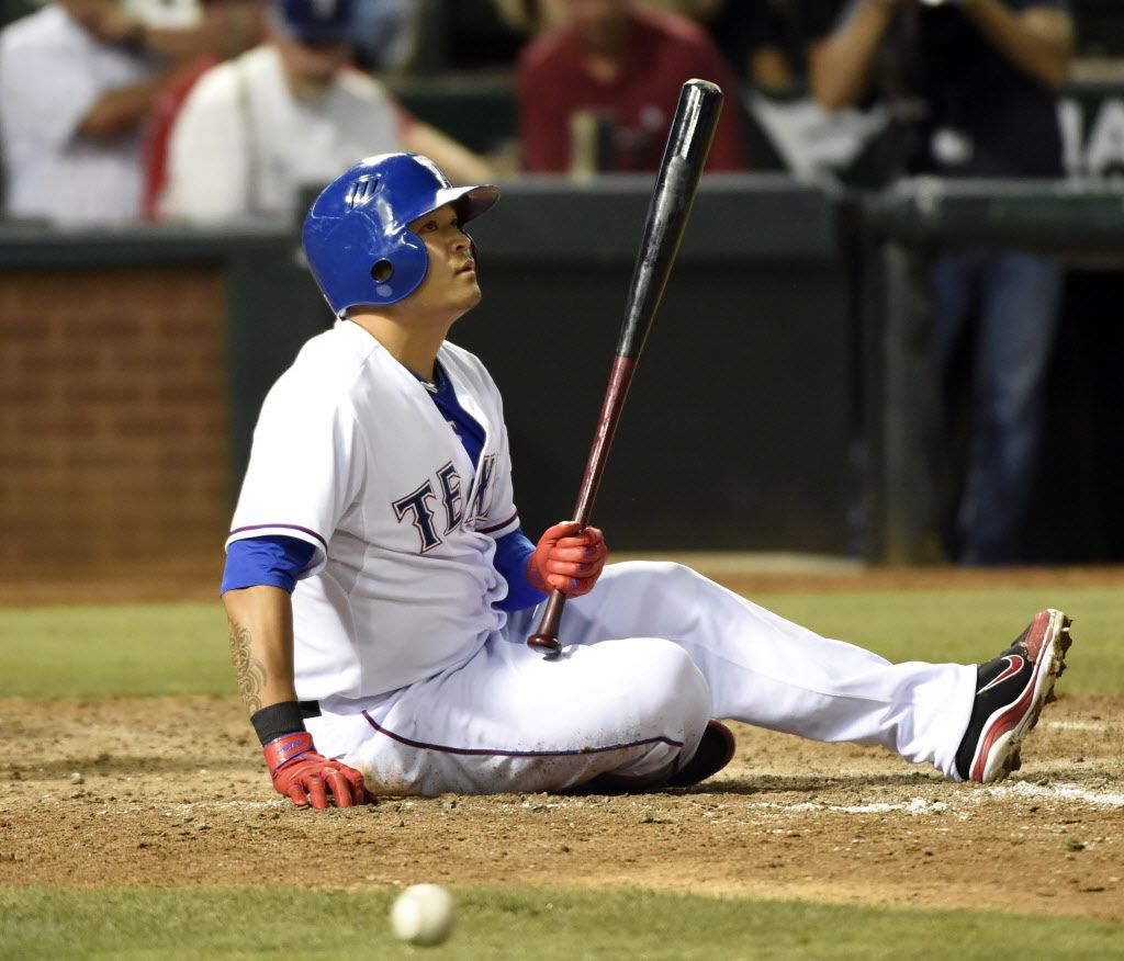 Texas Rangers' Shin-Soo Choo hits a sacrifice fly to score Rougned Odor in  the seventh inning of a baseball game against the Detroit Tigers in  Detroit, Thursday, June 27, 2019. (AP Photo/Paul