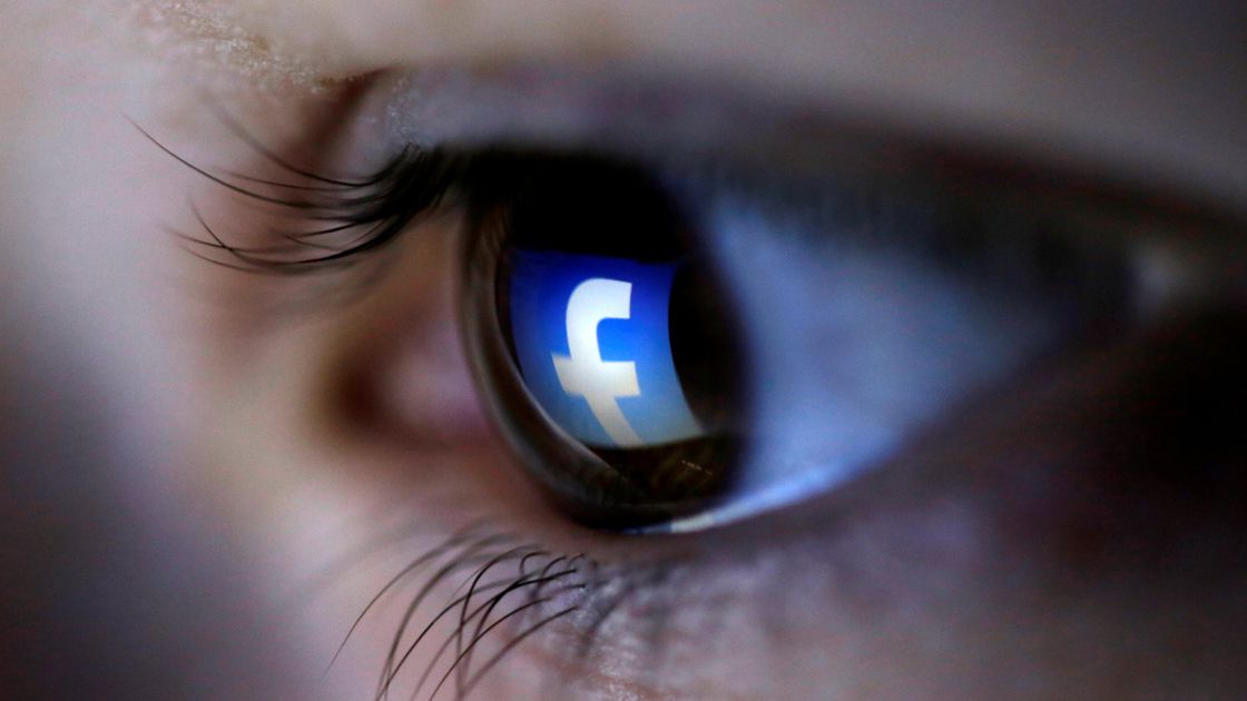 FILE PHOTO: A picture illustration shows a Facebook logo reflected in a person's eye, in Zenica