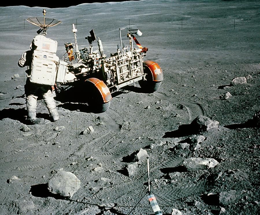 apollo-16-astronaut-charles-duke-with-lunar-rover-nasascience-photo-library.jpg