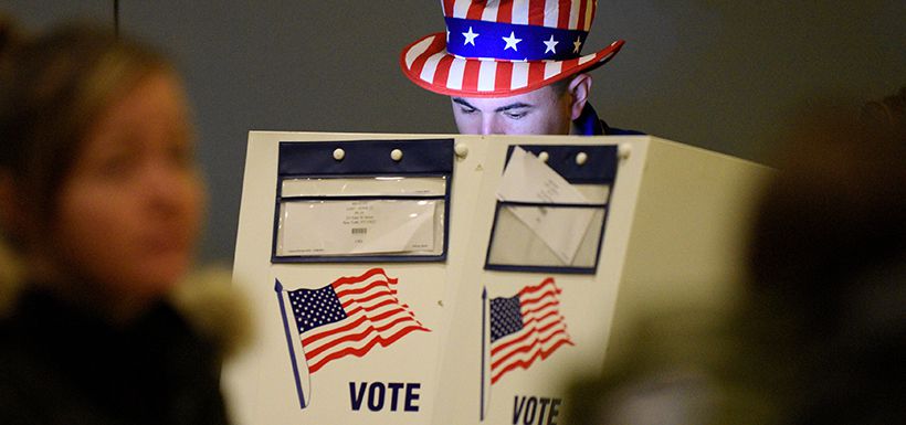 Travis Lopes, 30, casts his vote for the U.S. presidential election in the Manhattan borough of New York